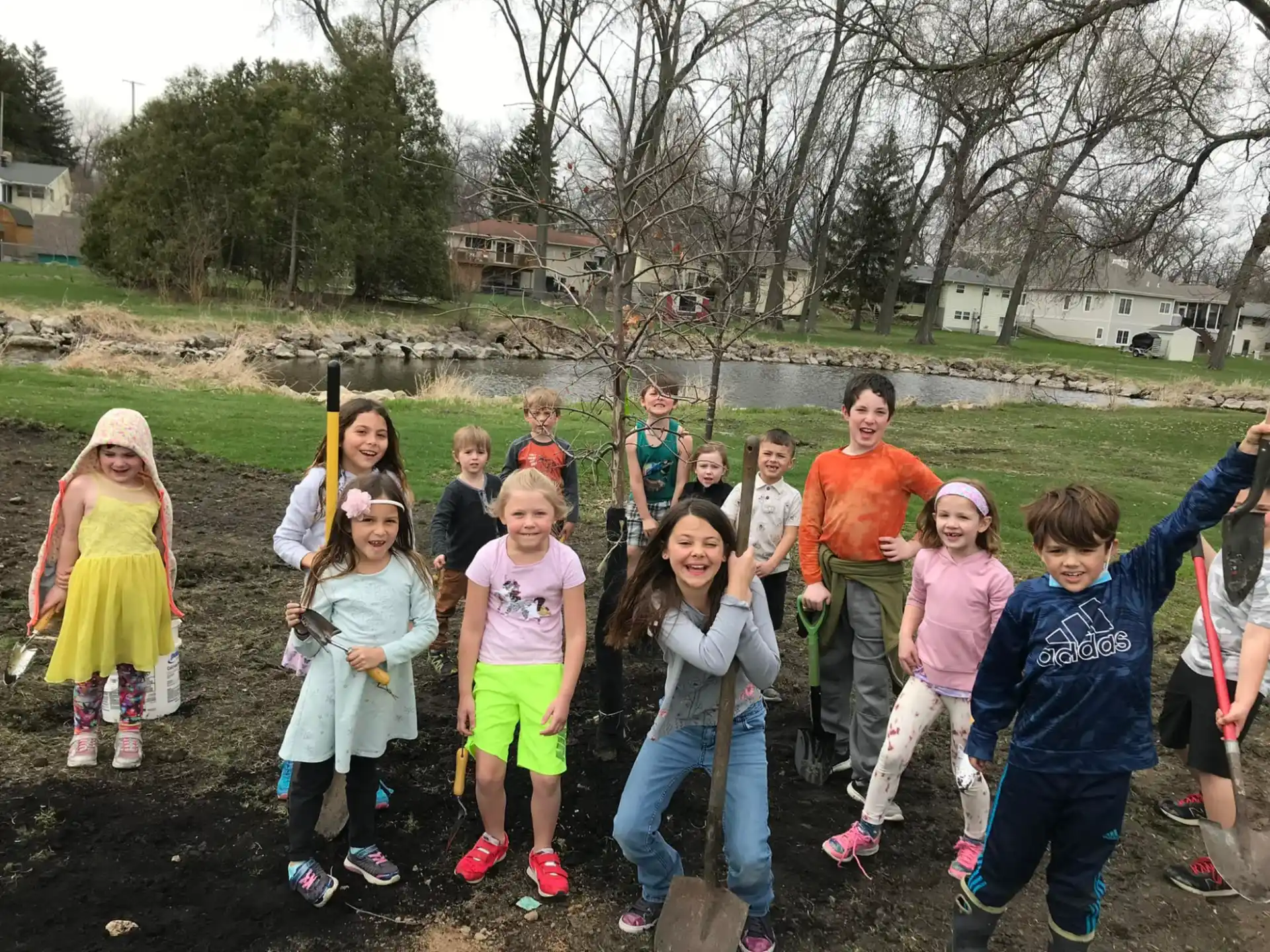 a group of children holding a stick