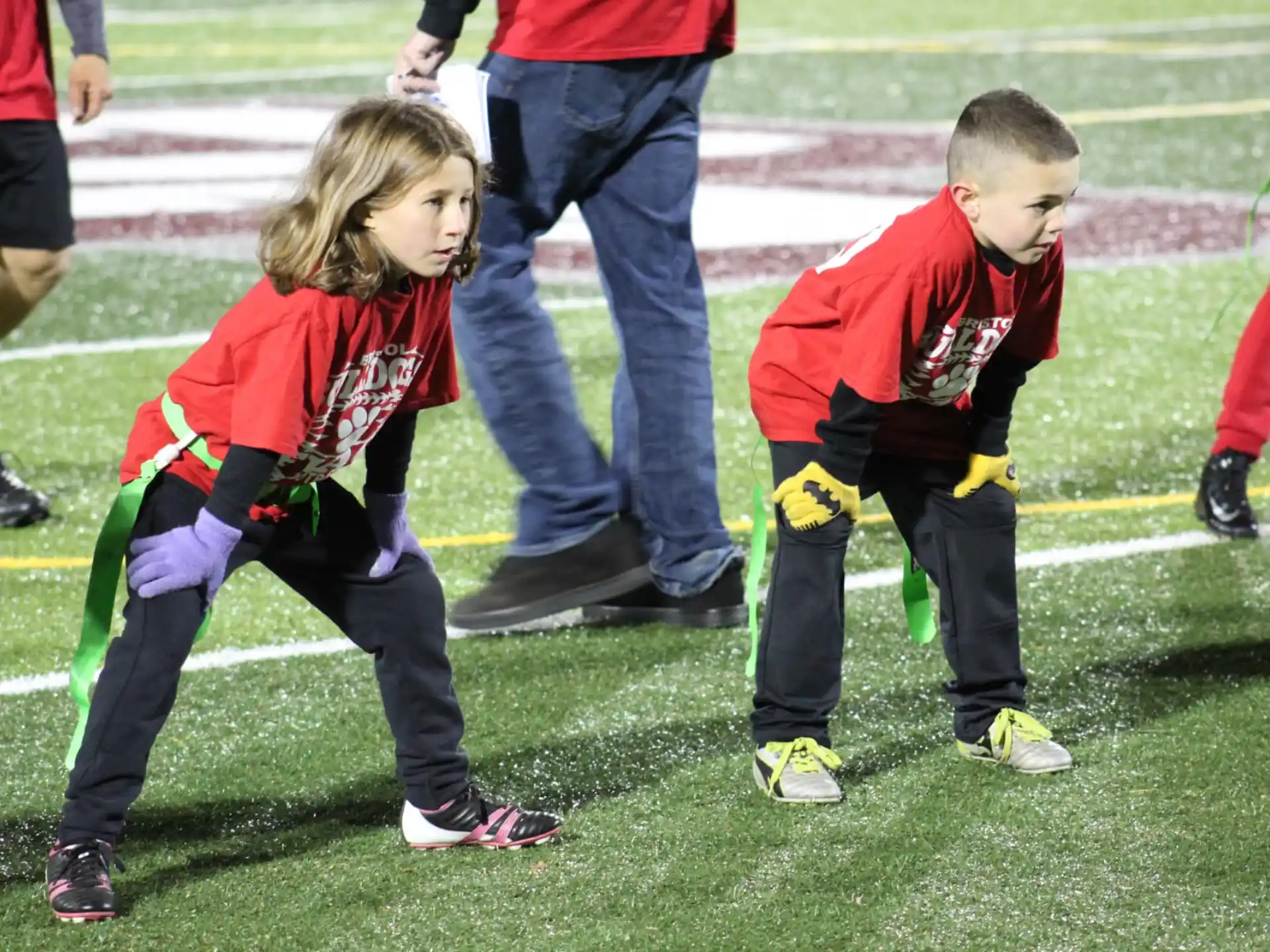 children in matching outfits on a field