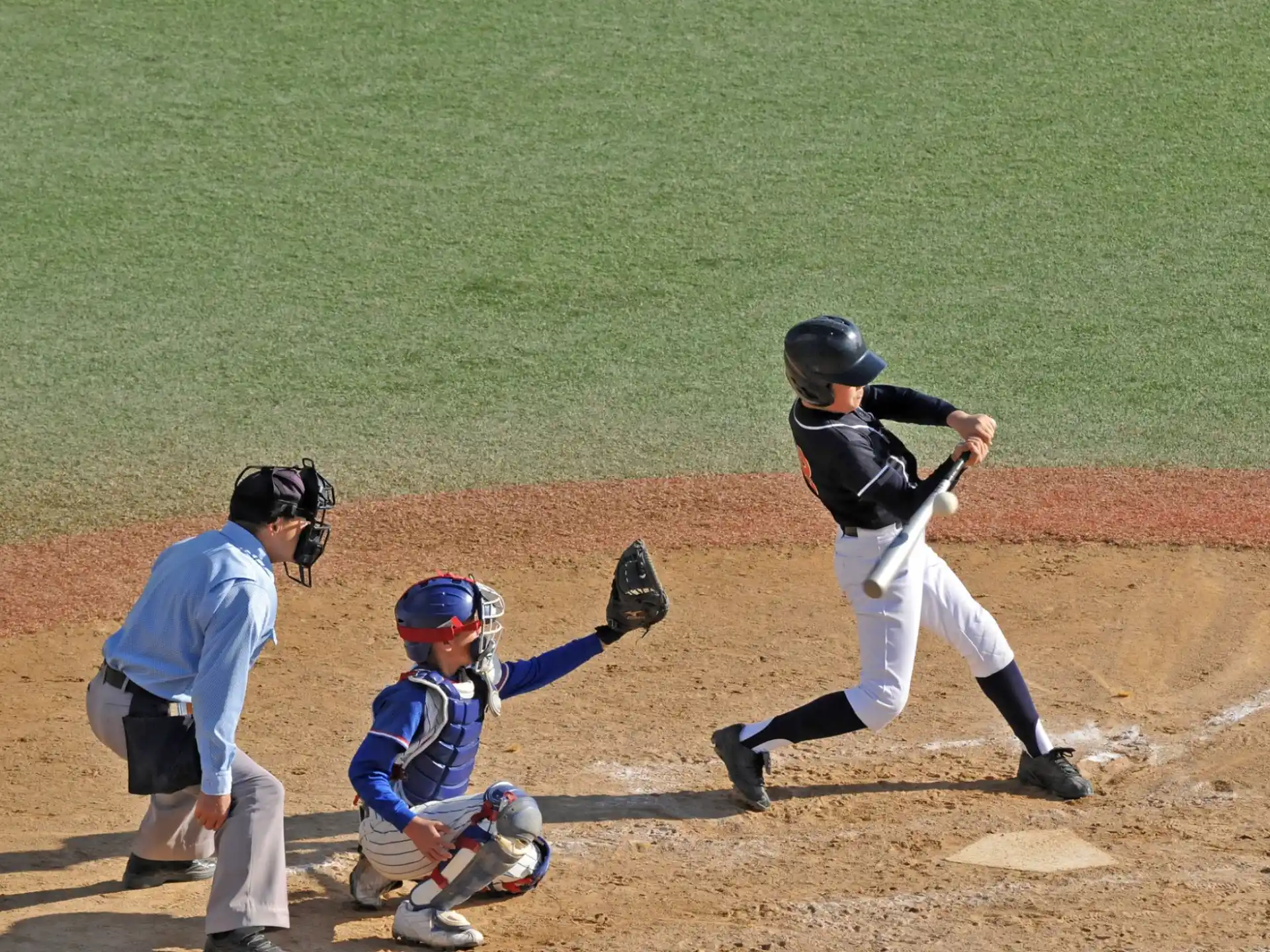 a baseball player swinging a bat