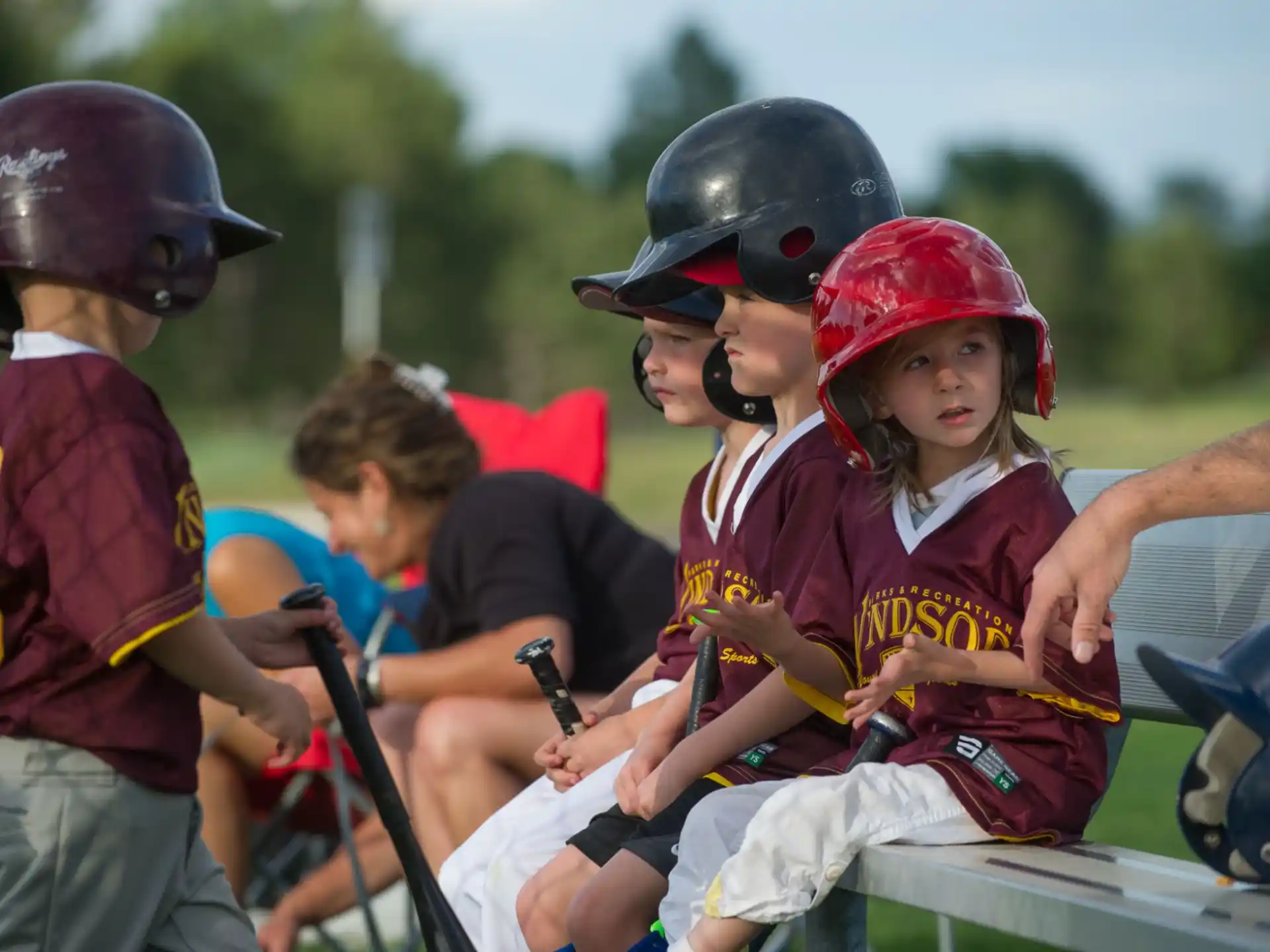 a group of kids wearing helmets