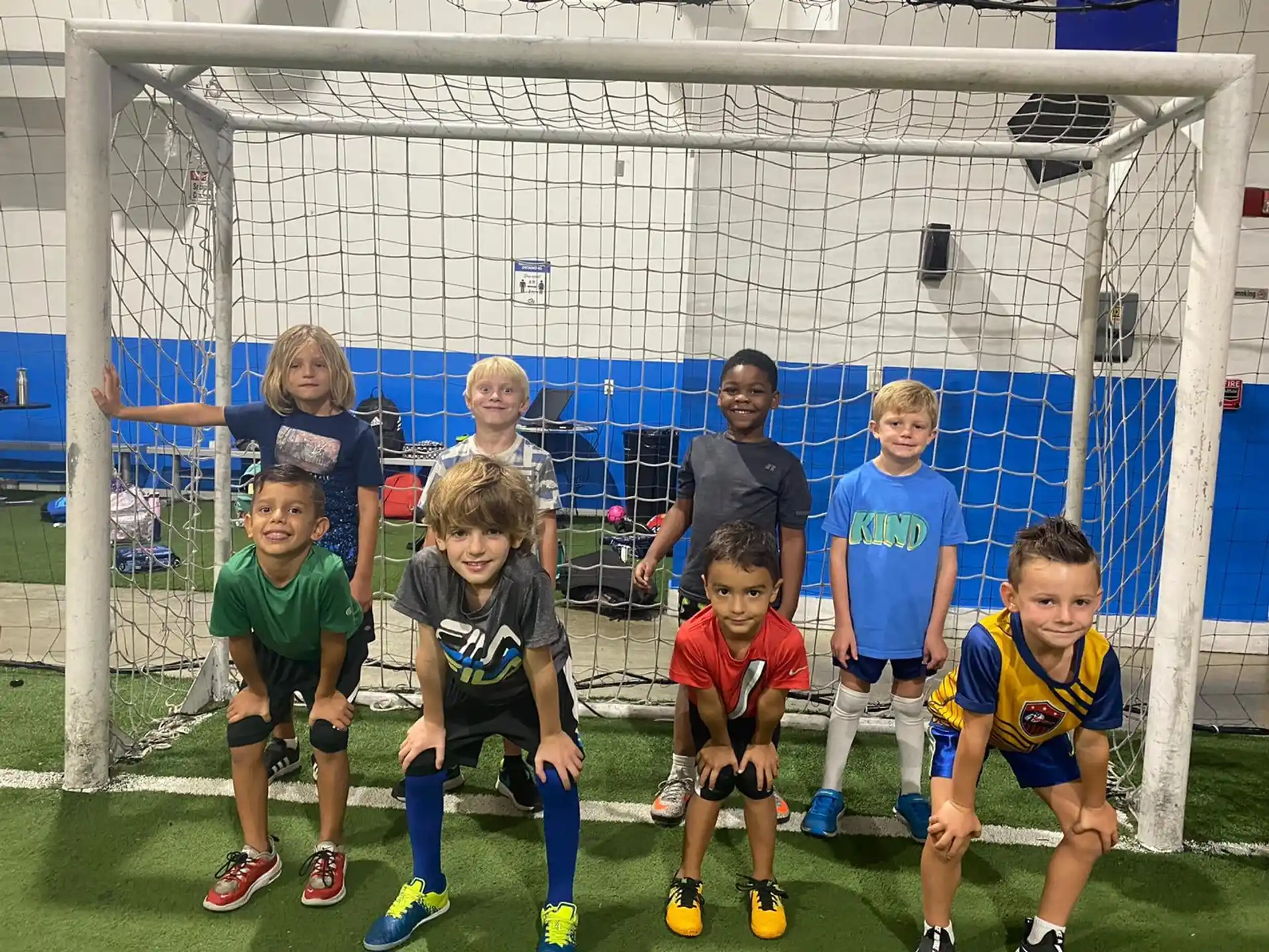a group of kids posing for a picture