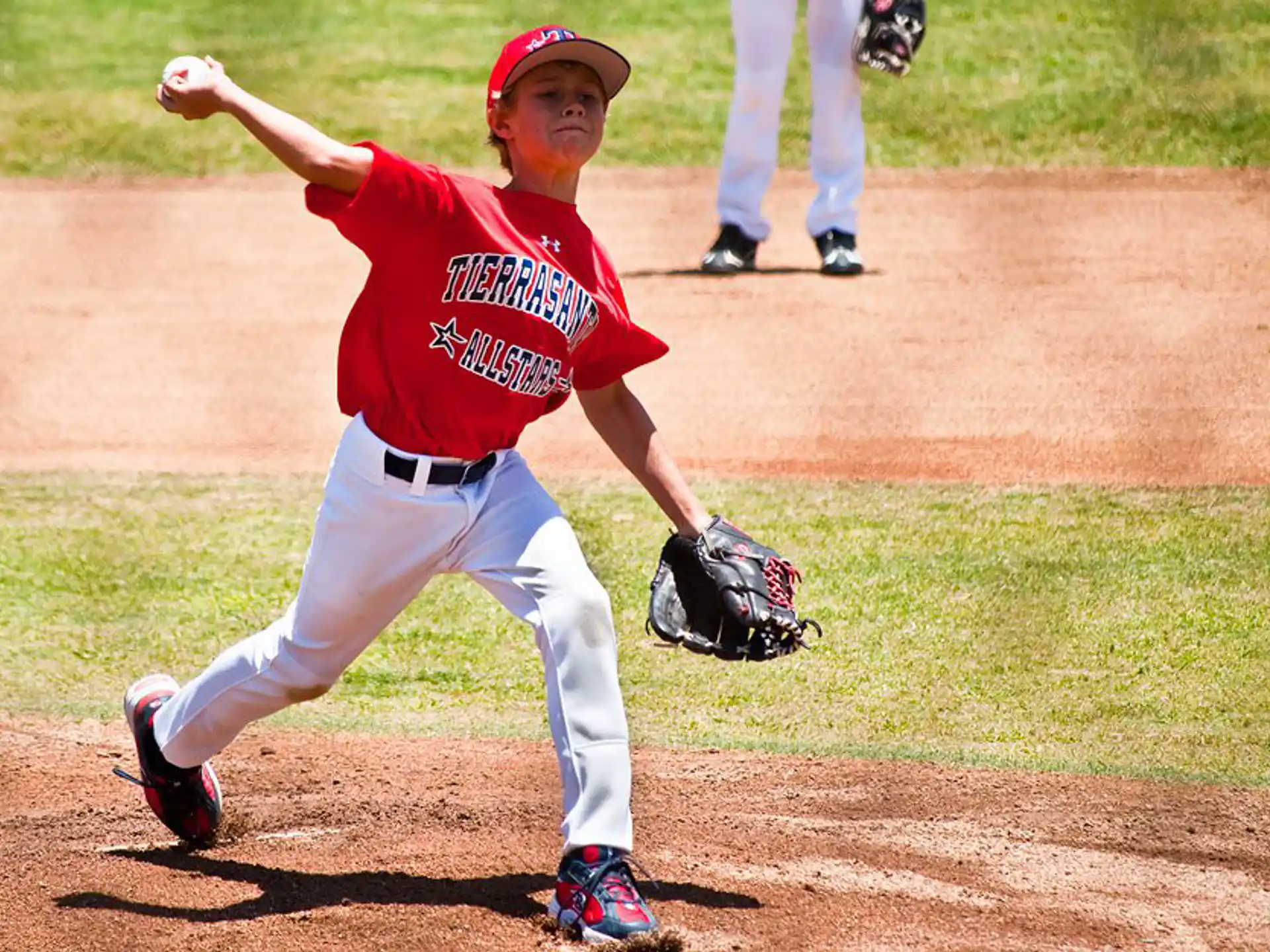 a baseball player throwing a ball