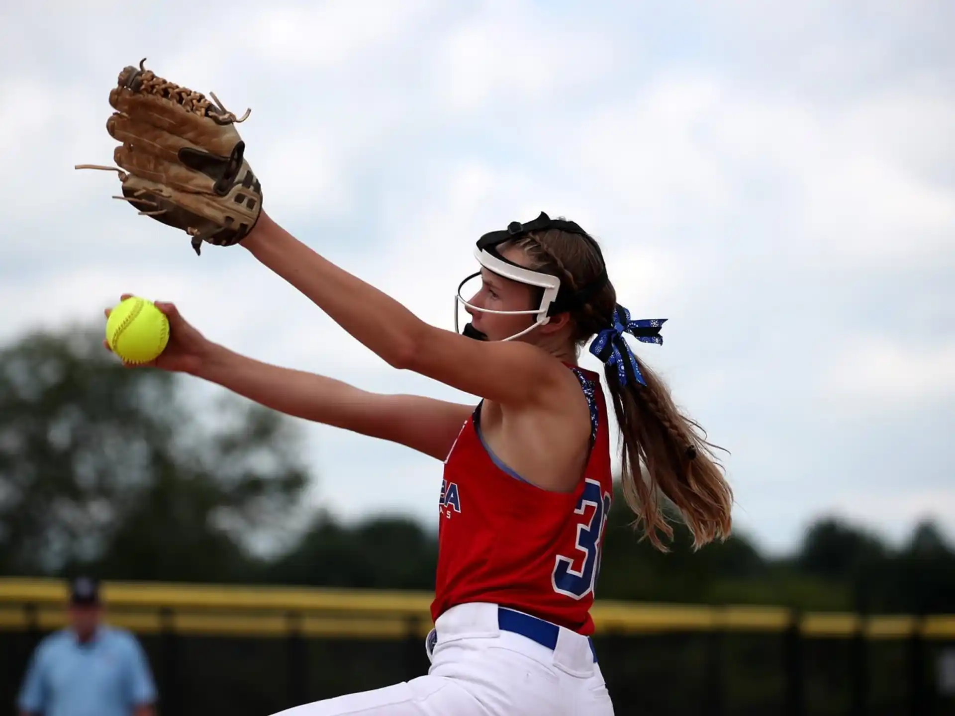 a person throwing a baseball