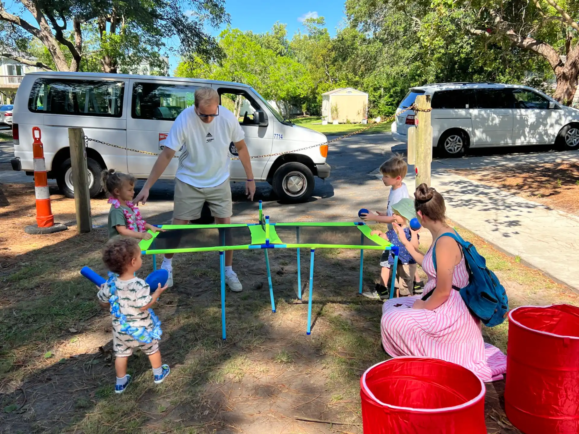 a group of people playing with toys