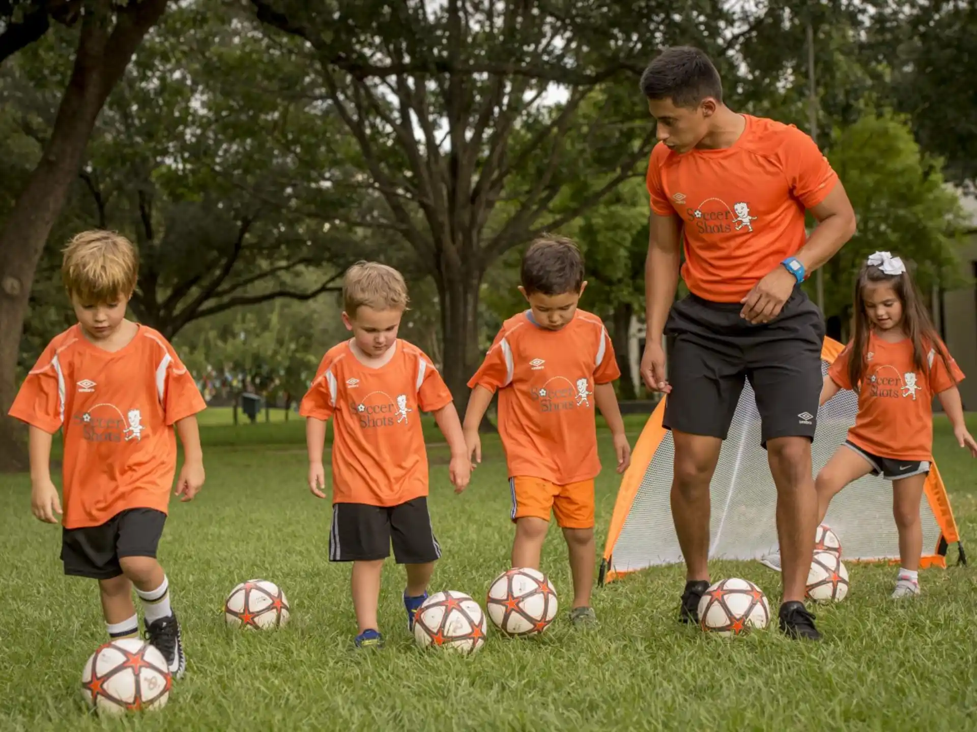 a group of kids playing football