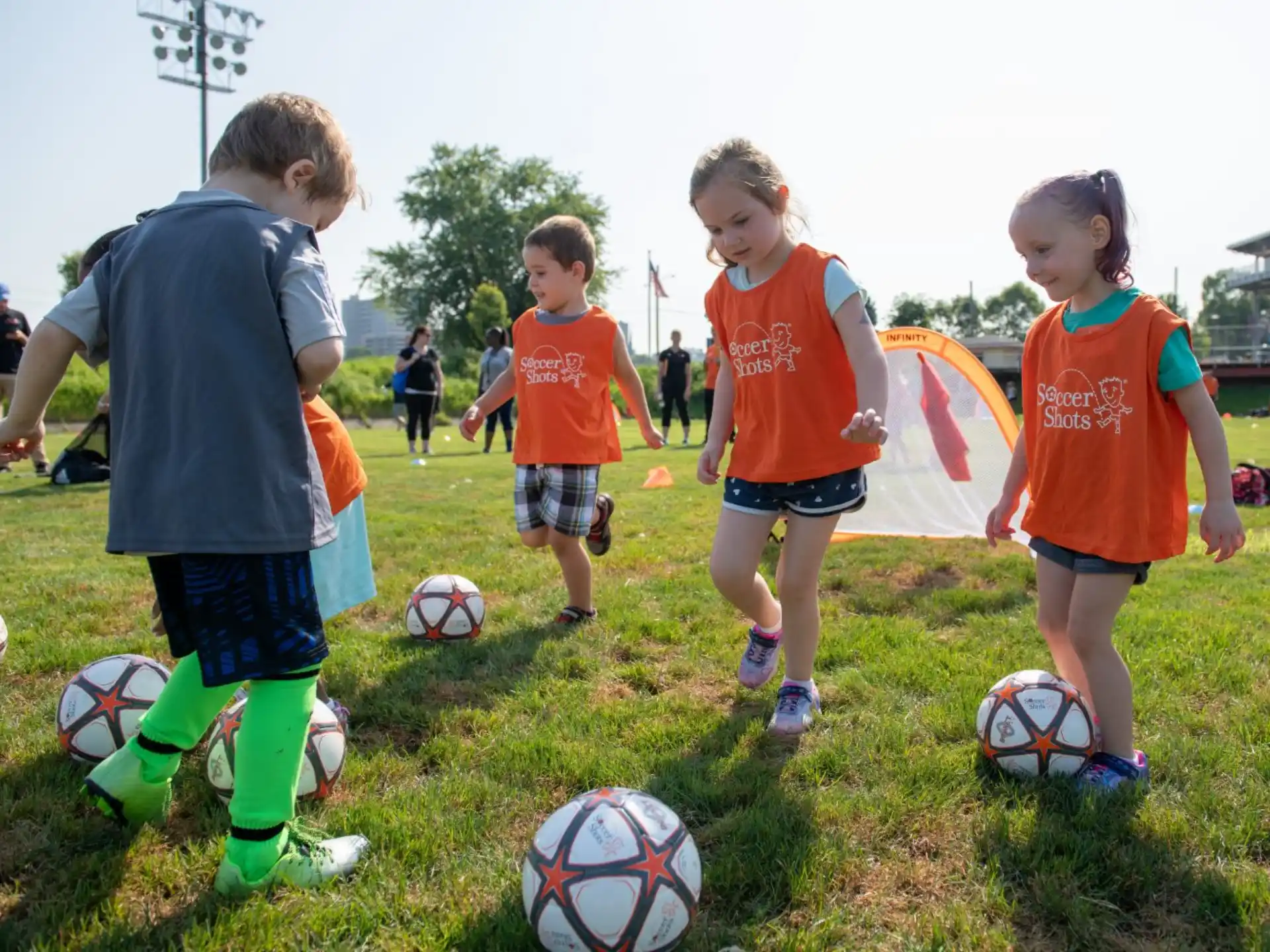 a group of kids playing football