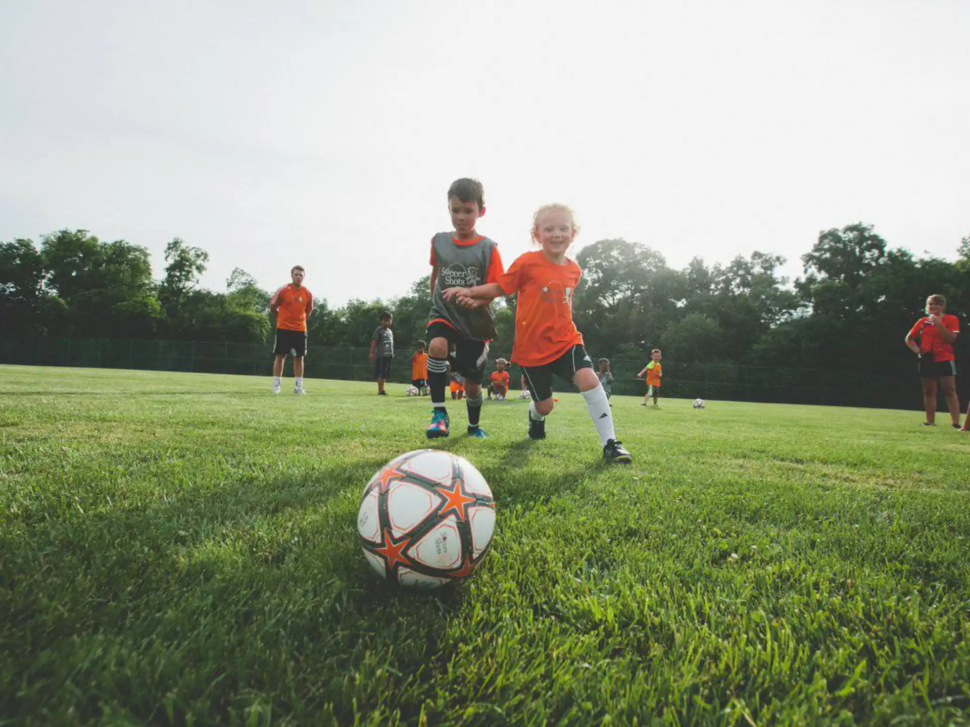kids playing football on a field