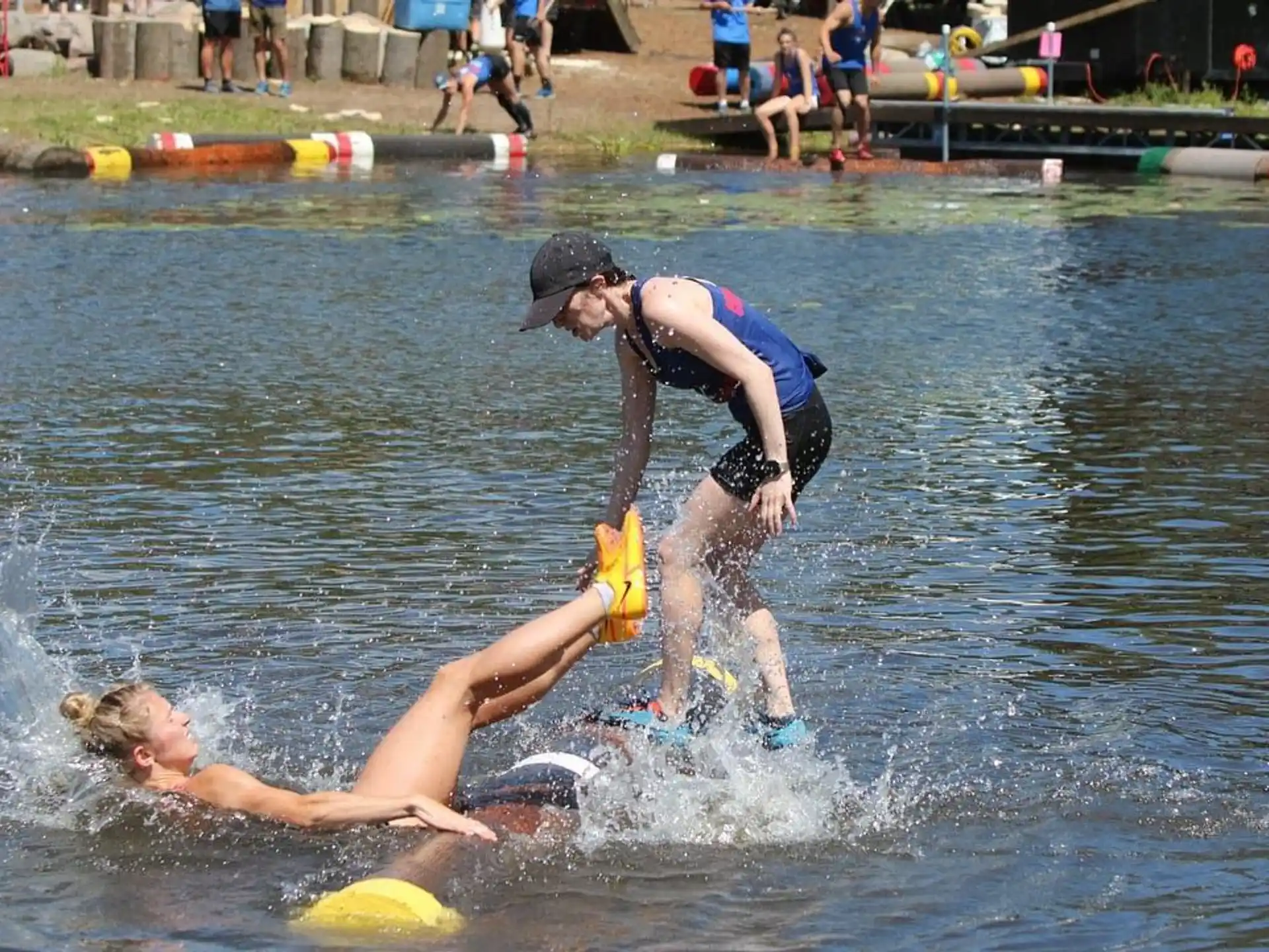a group of people playing in the water