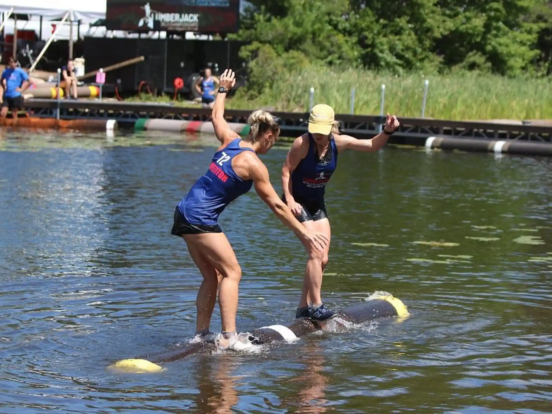 women are performing surfing in the water