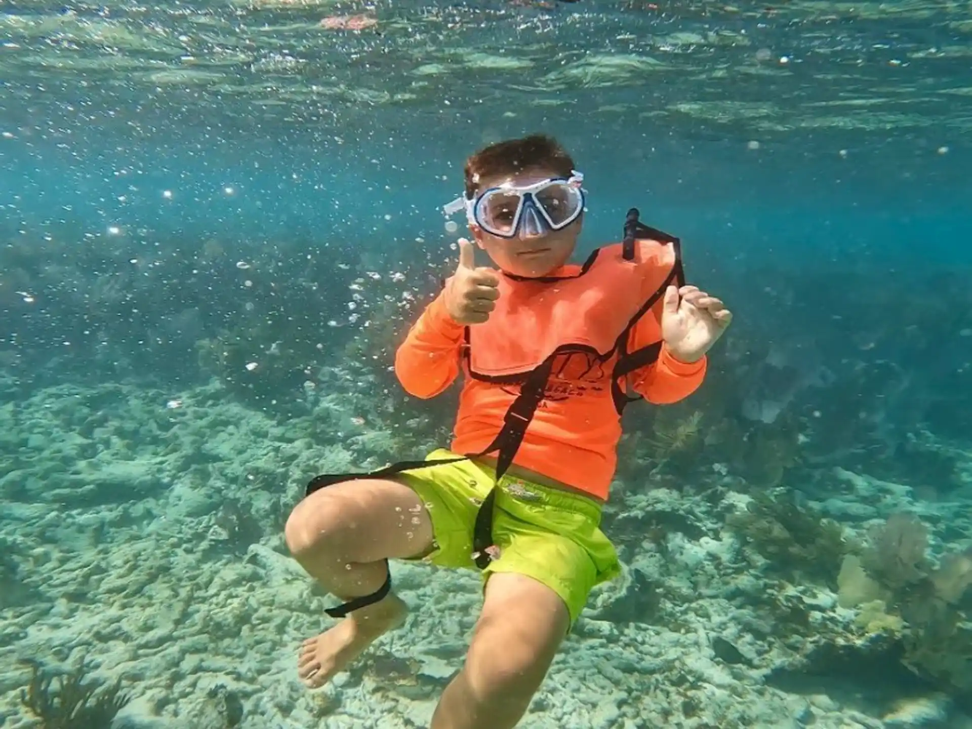 a person wearing goggles and swimming