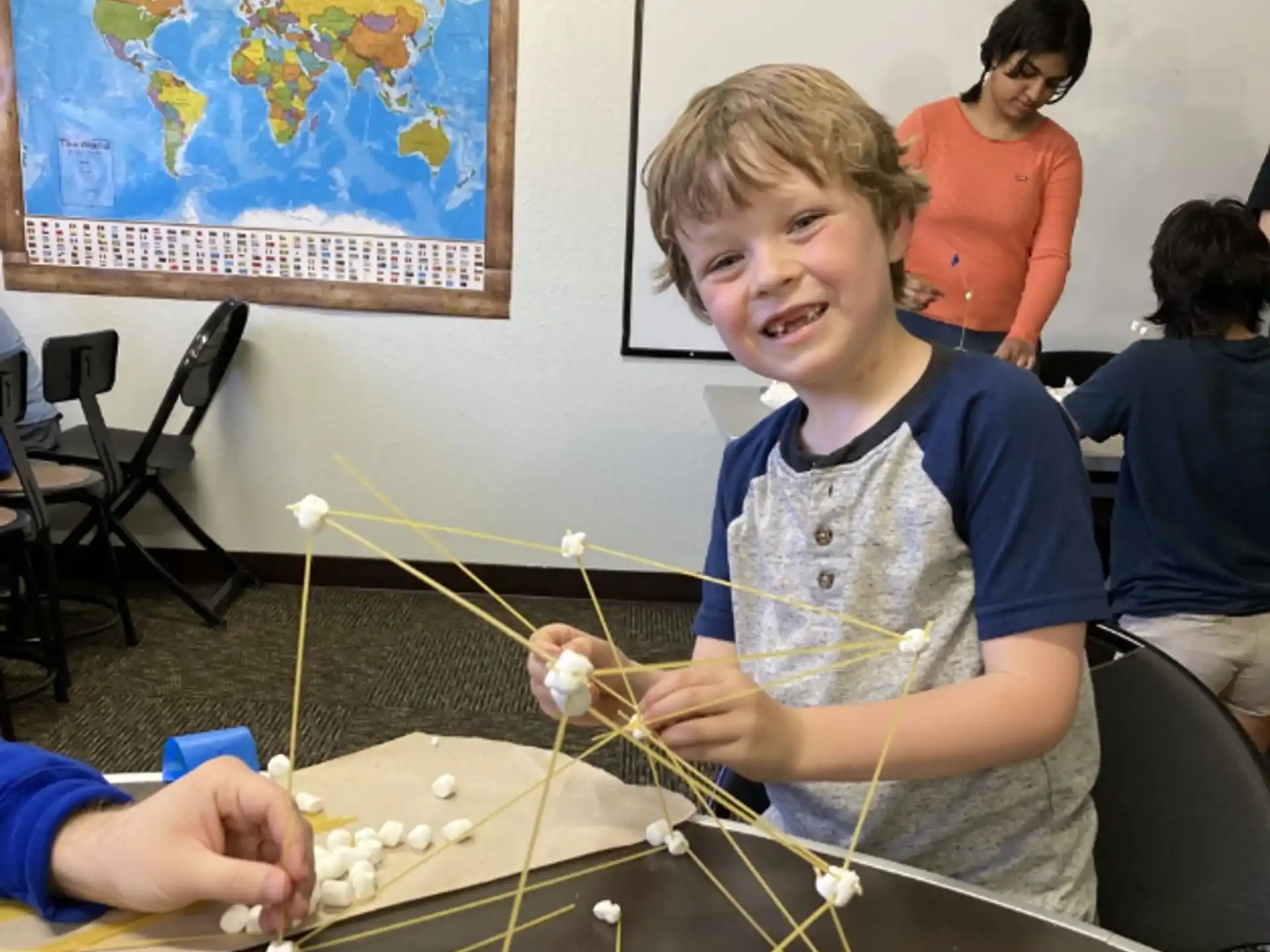 a boy playing with a toy