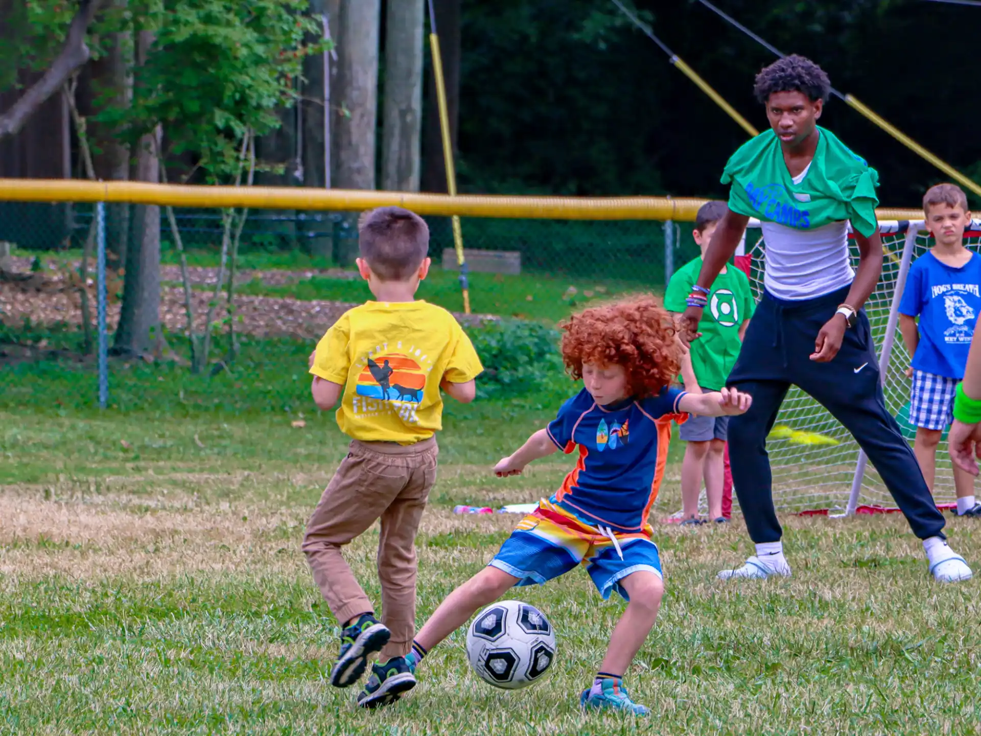 kids playing football on a field
