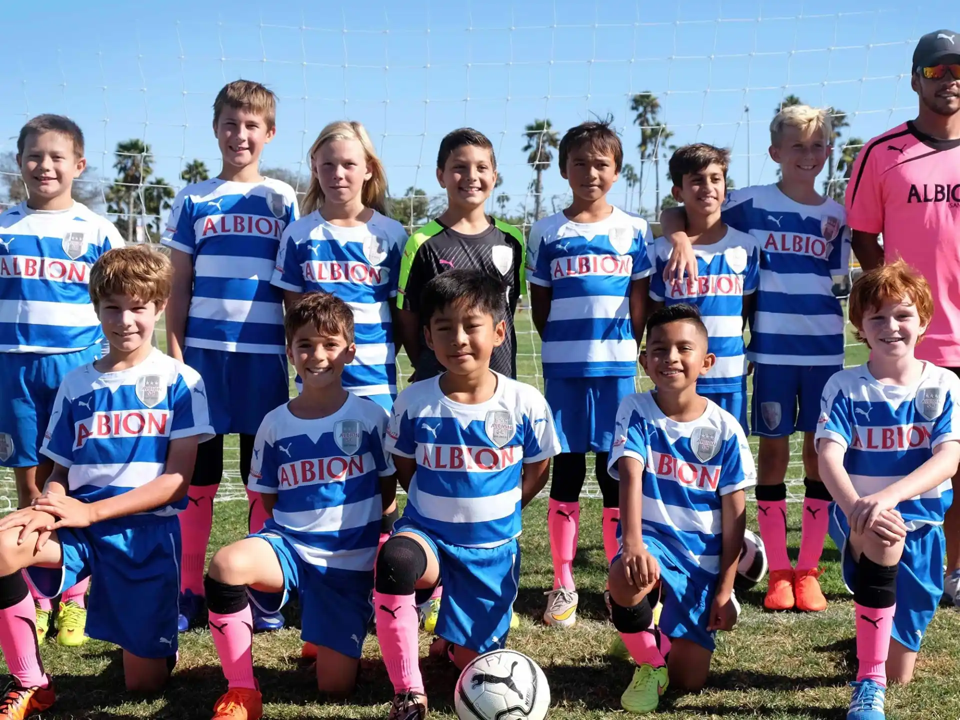 a group of kids posing for a picture