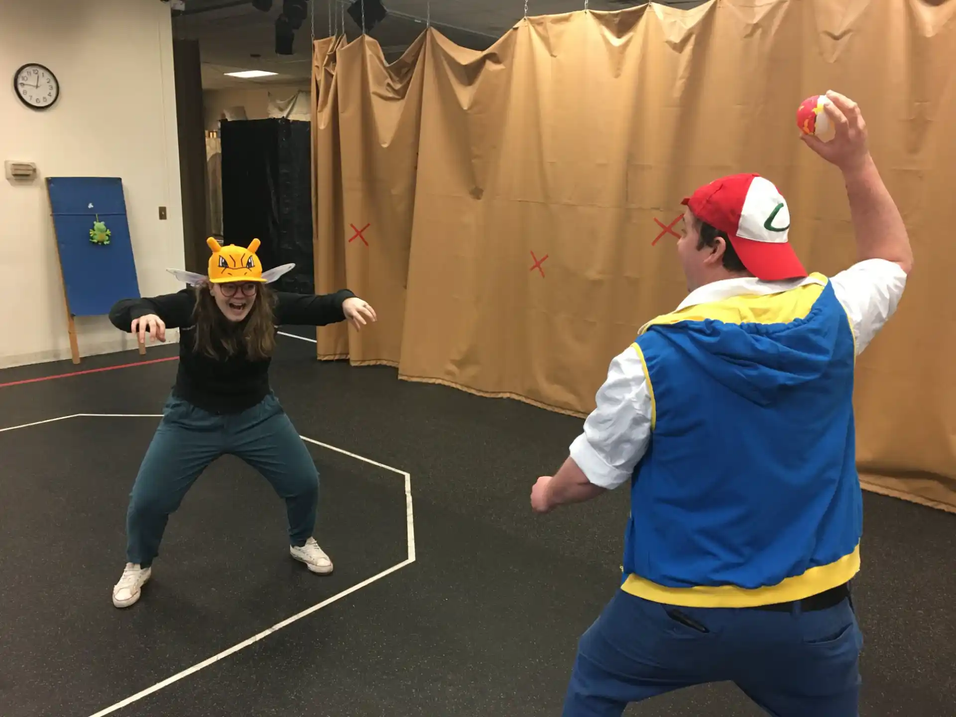 a woman and a man playing a game of ping pong