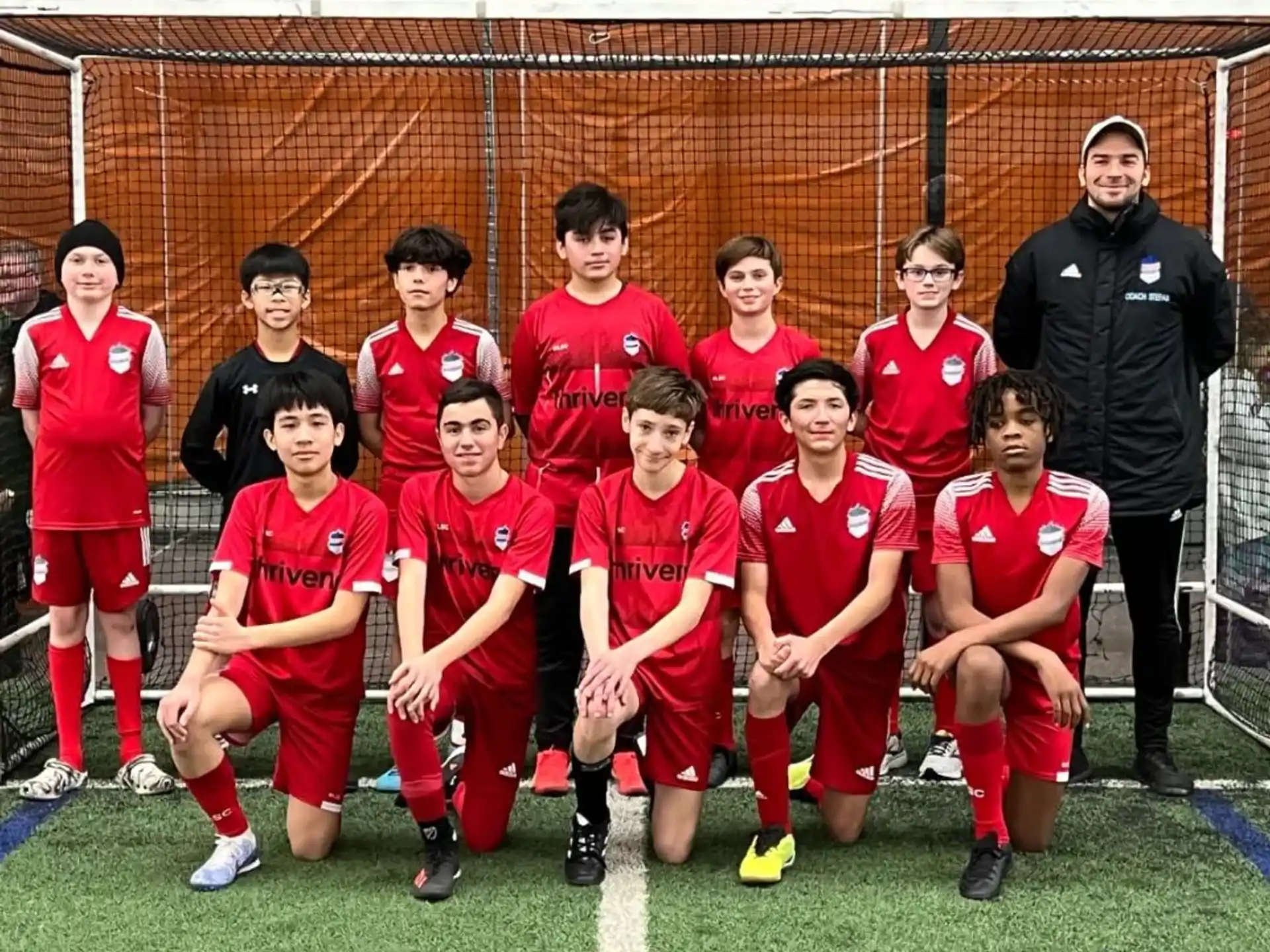 a group of football players posing for a photo