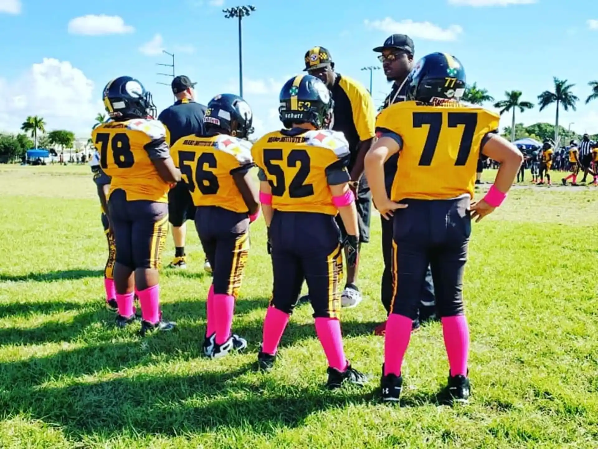 a group of kids wearing football gear
