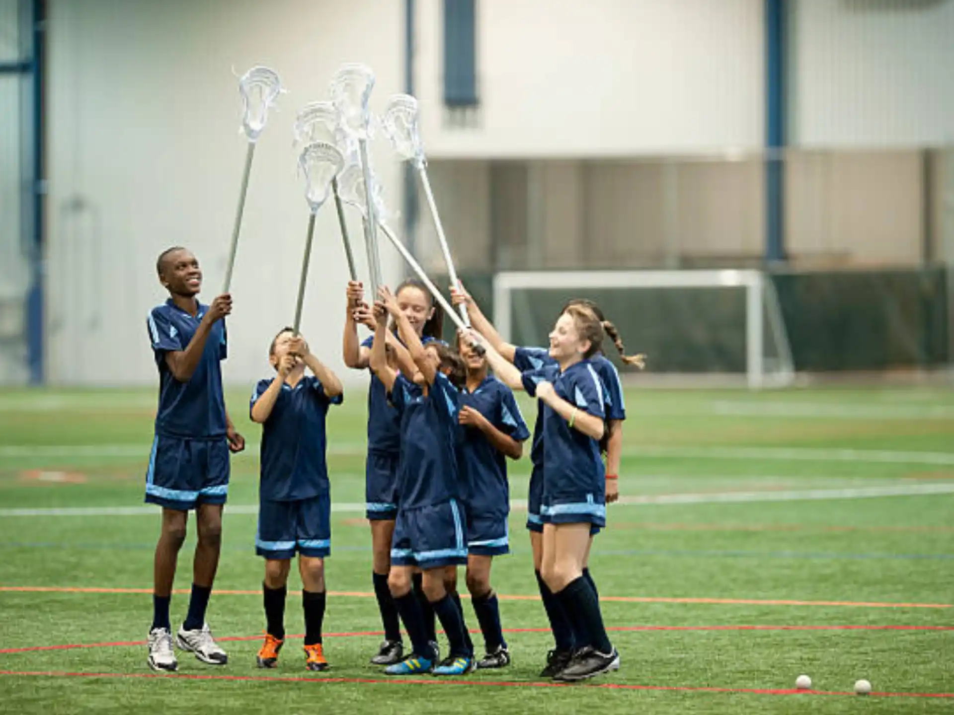 a group of girls holding a trophy