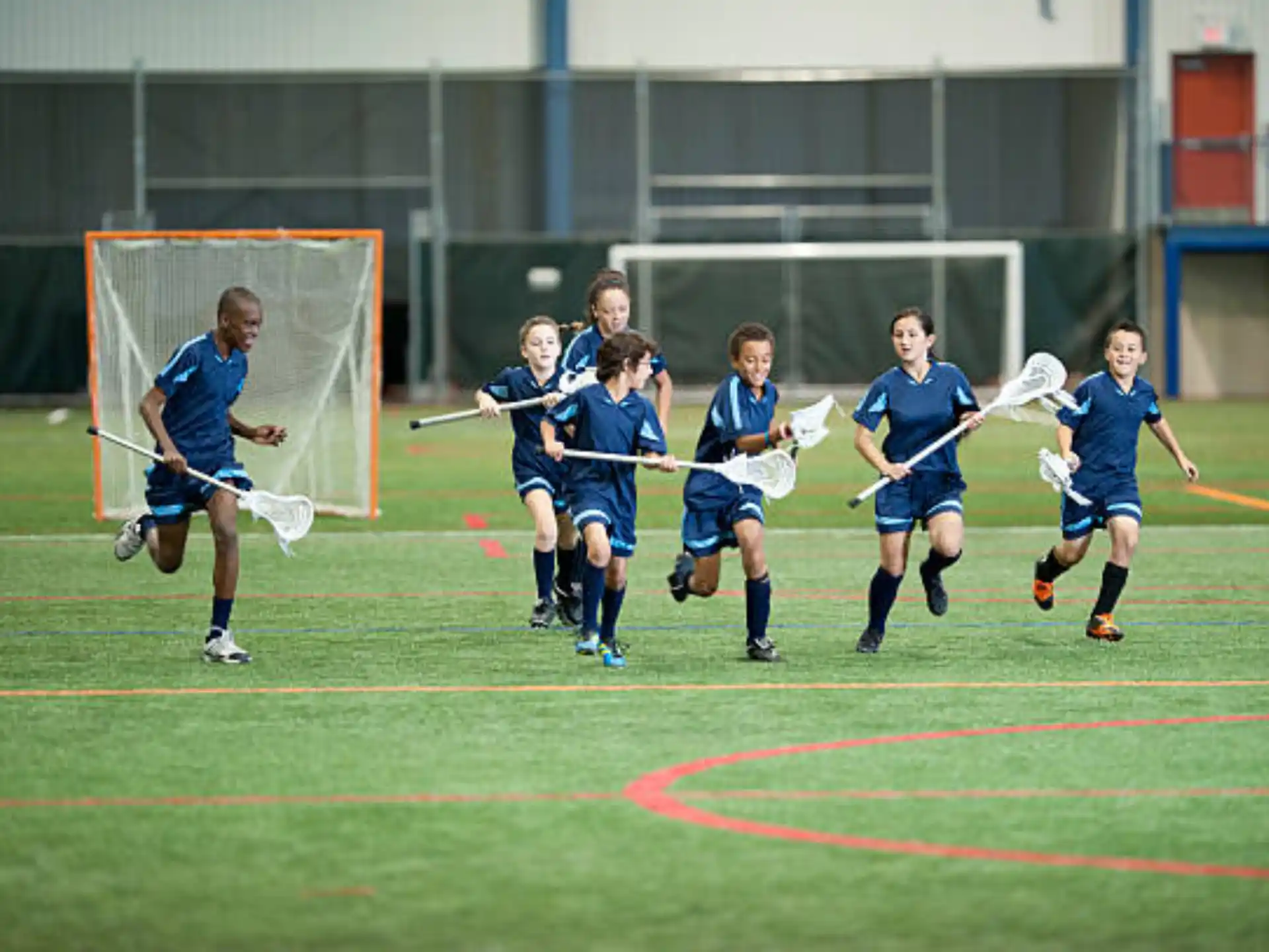 a group of kids playing football