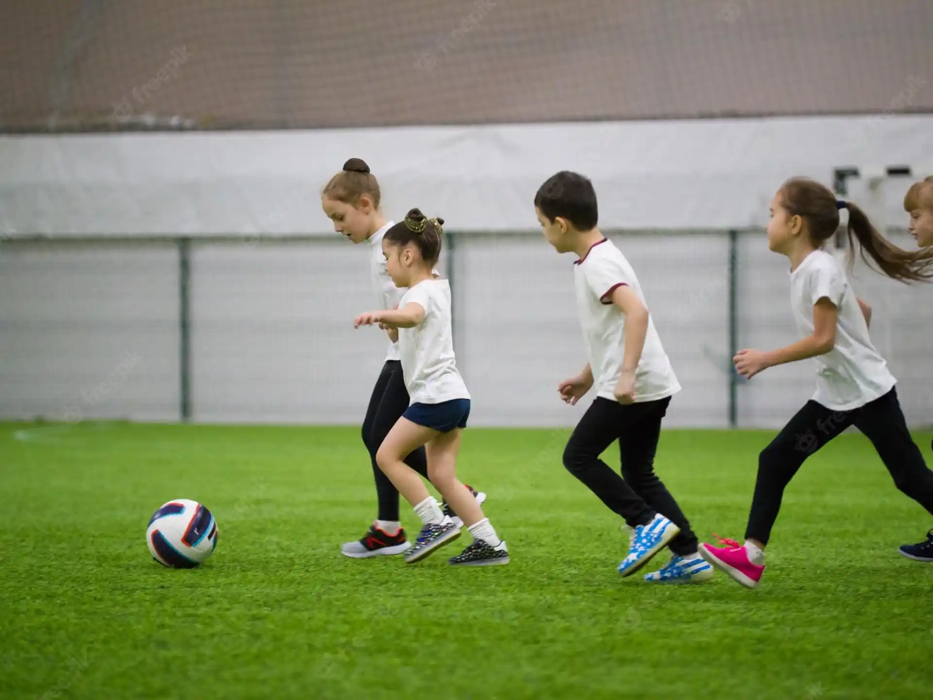 a group of kids playing football