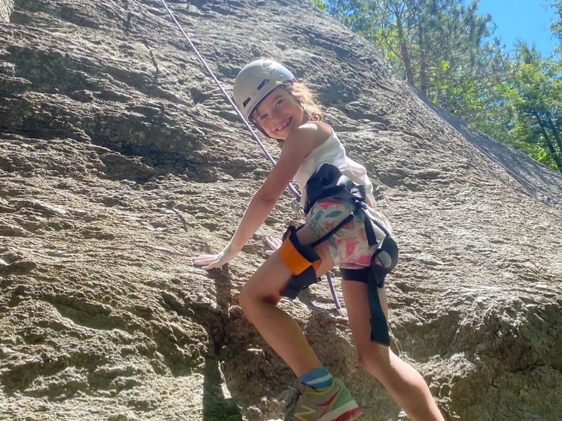a man climbing a rock