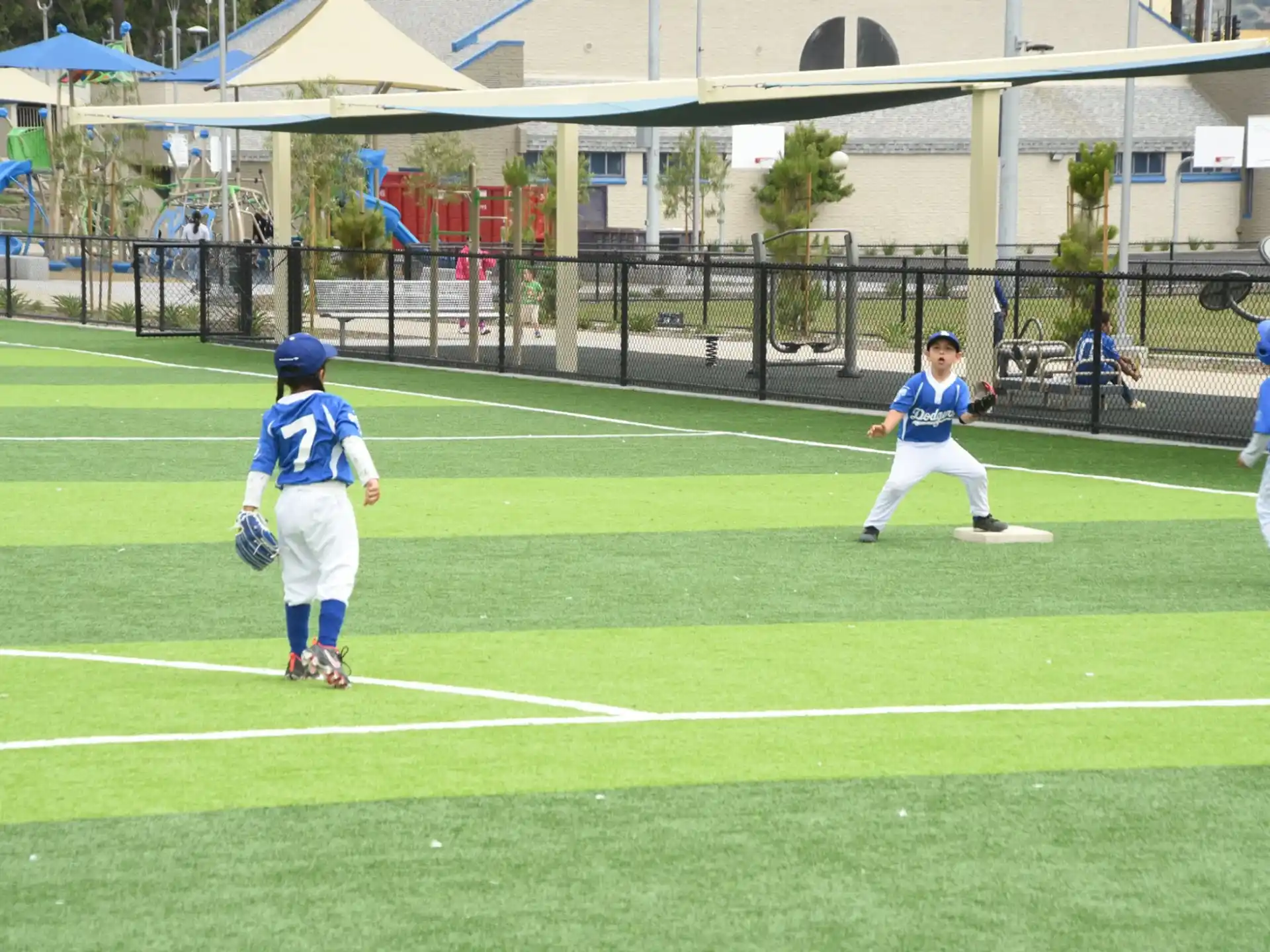 kids playing baseball on a field