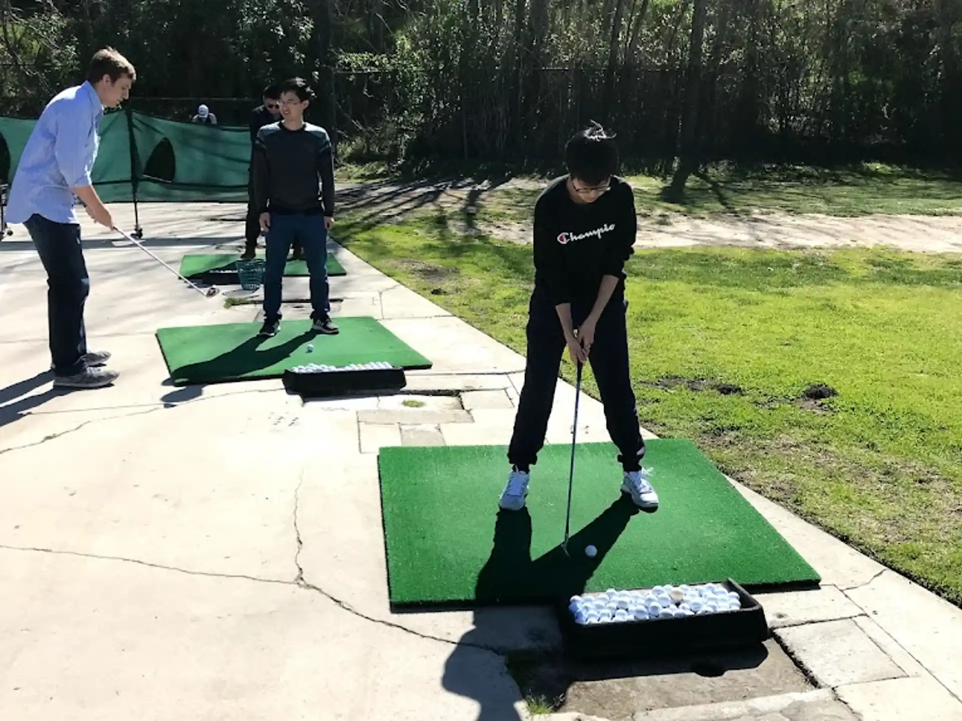 a group of people playing golf
