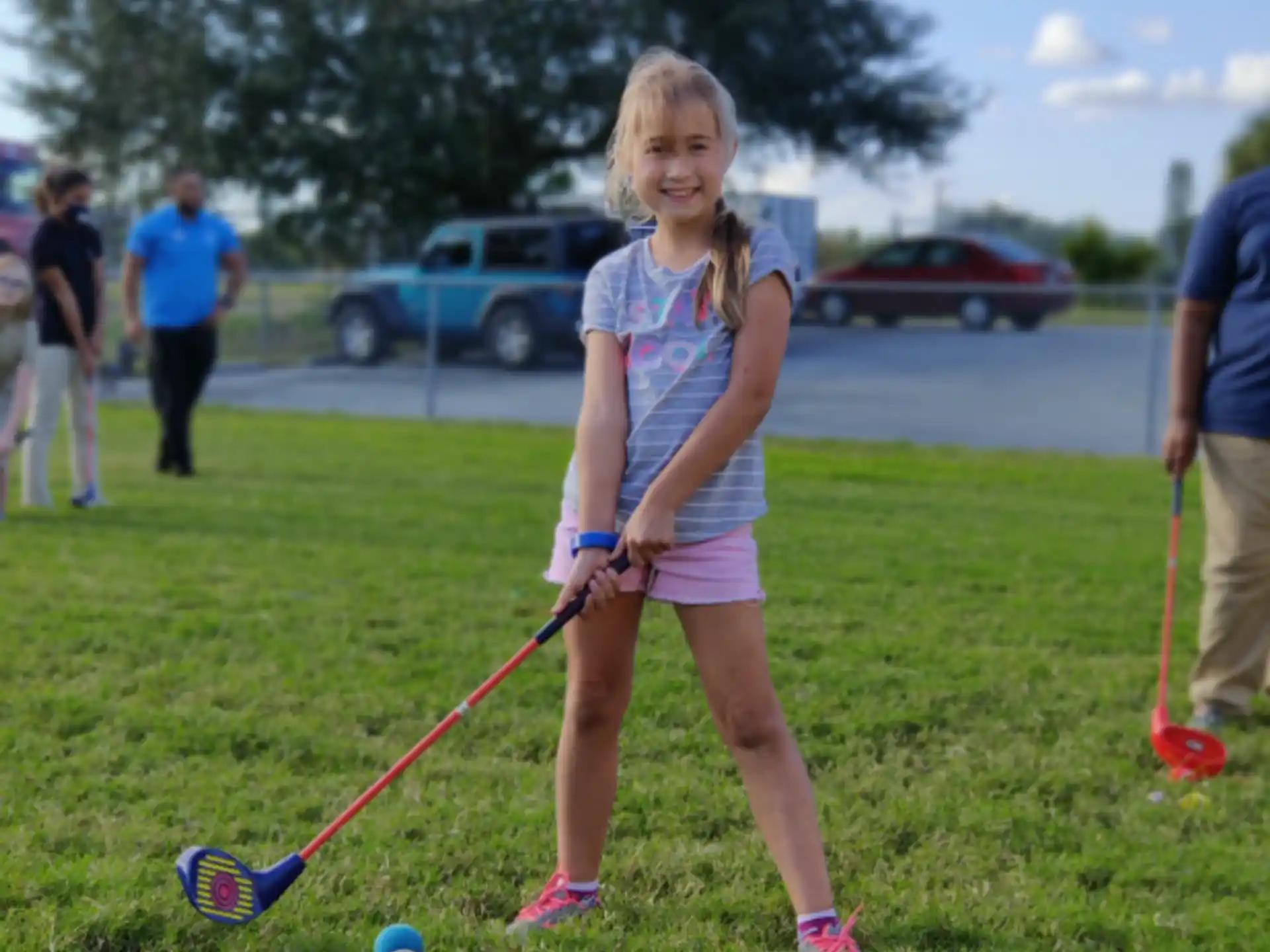 a girl holding a toy