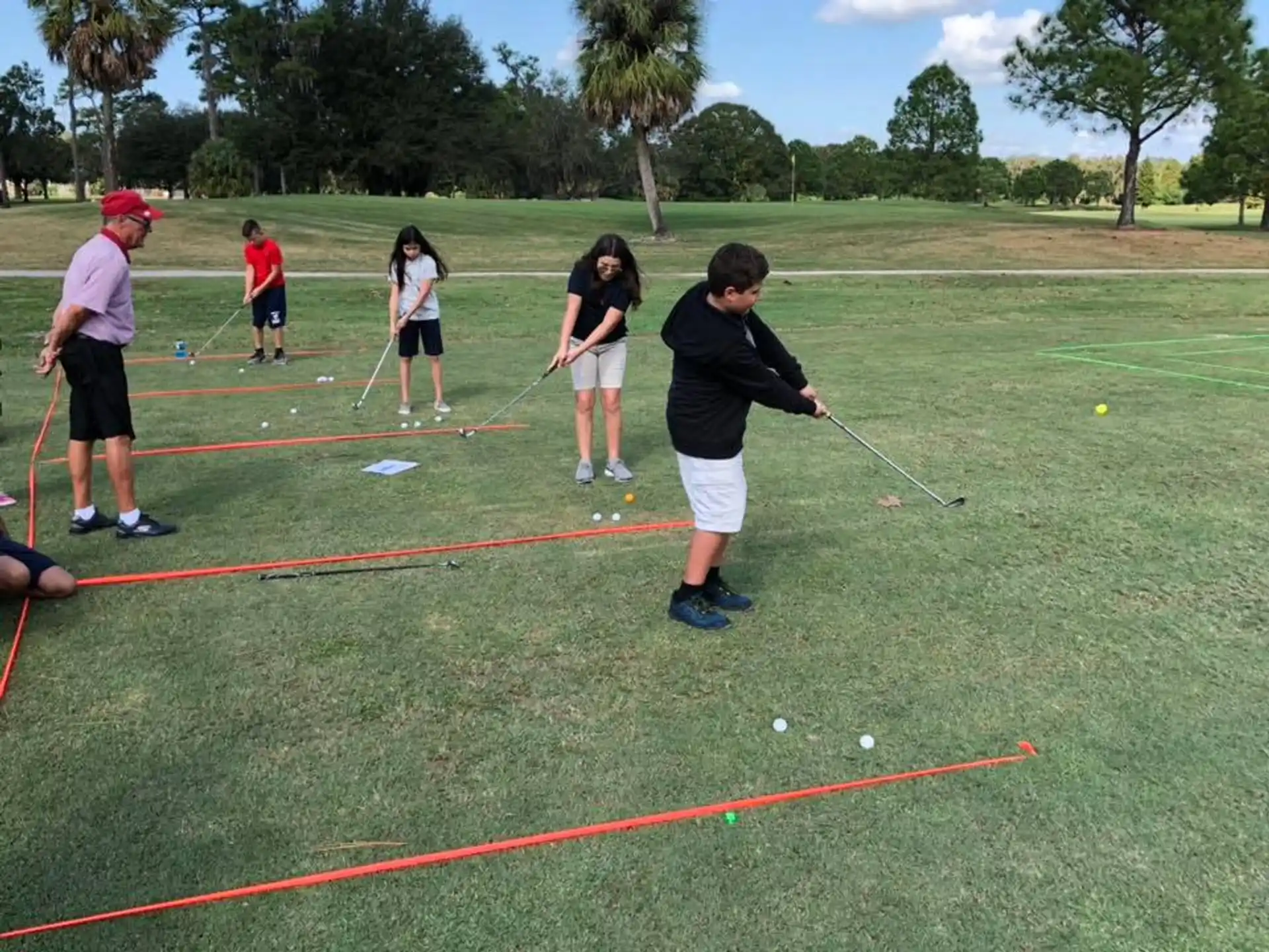 a group of people playing golf