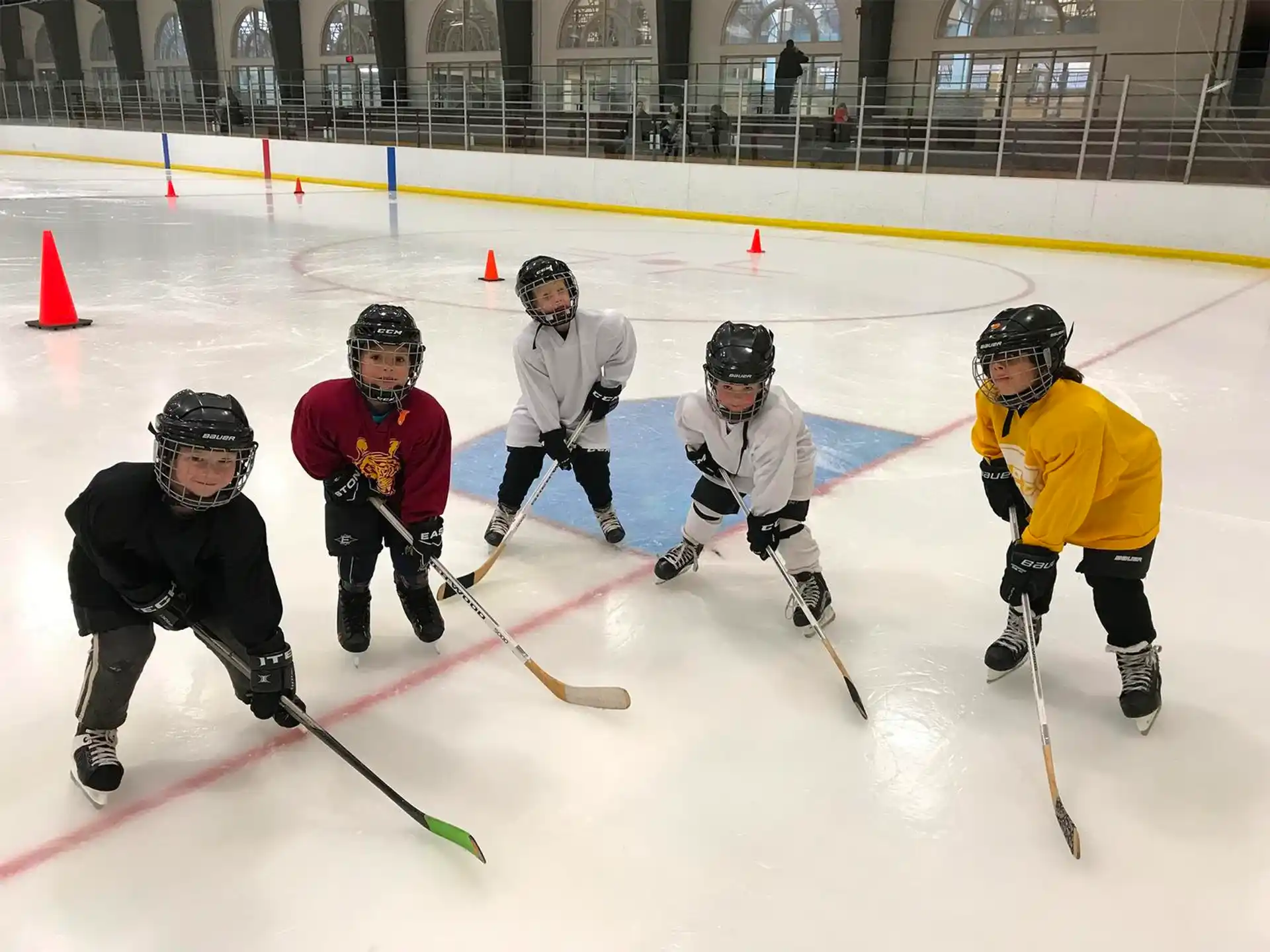 a group of people playing hockey