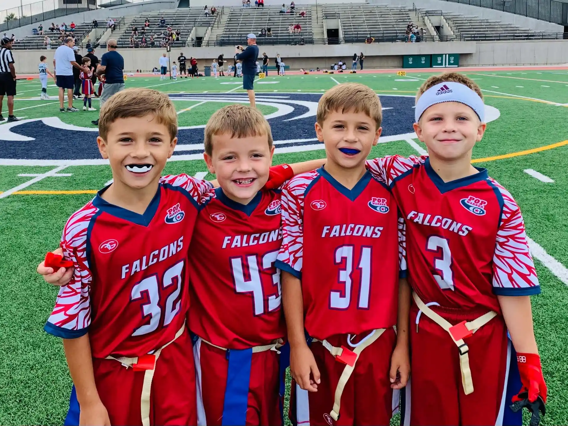 a group of boys in sports uniforms