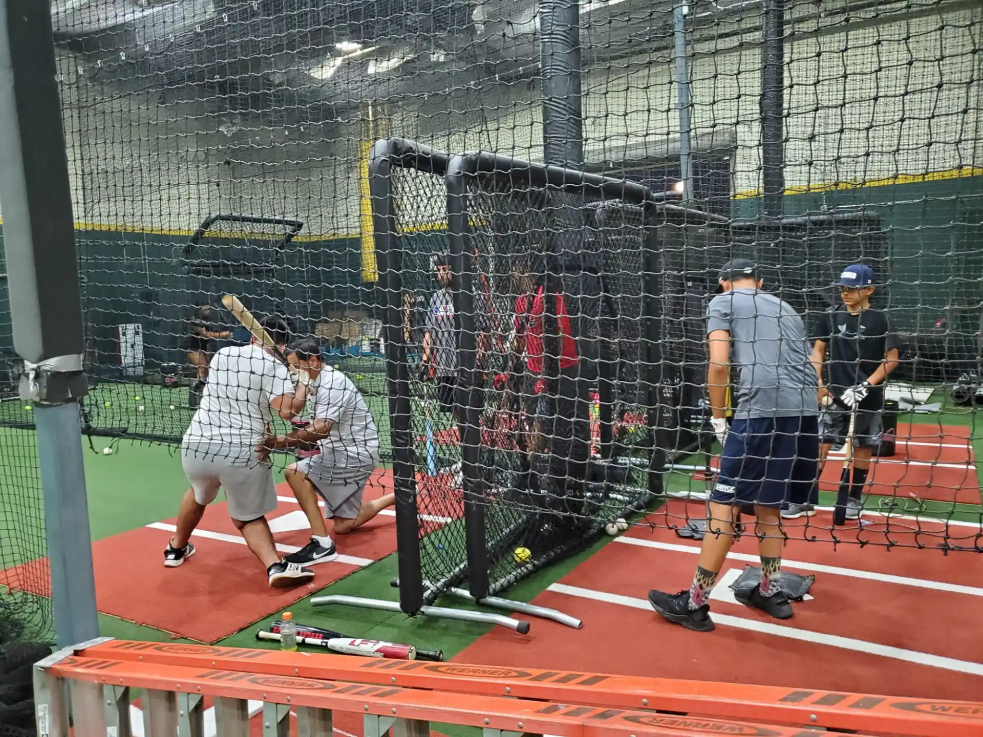 a baseball player prepares to swing a bat