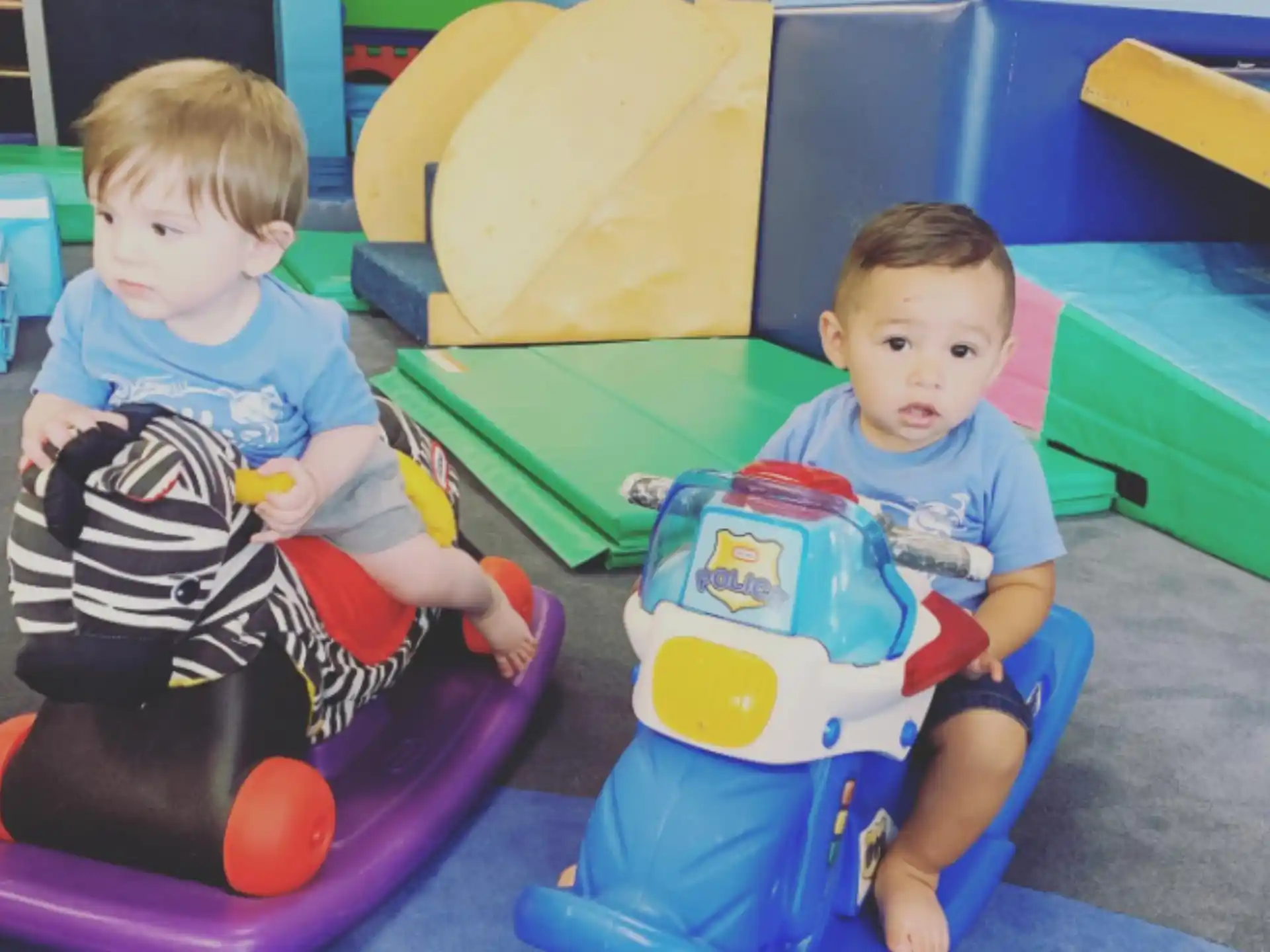 two kids sitting in toys