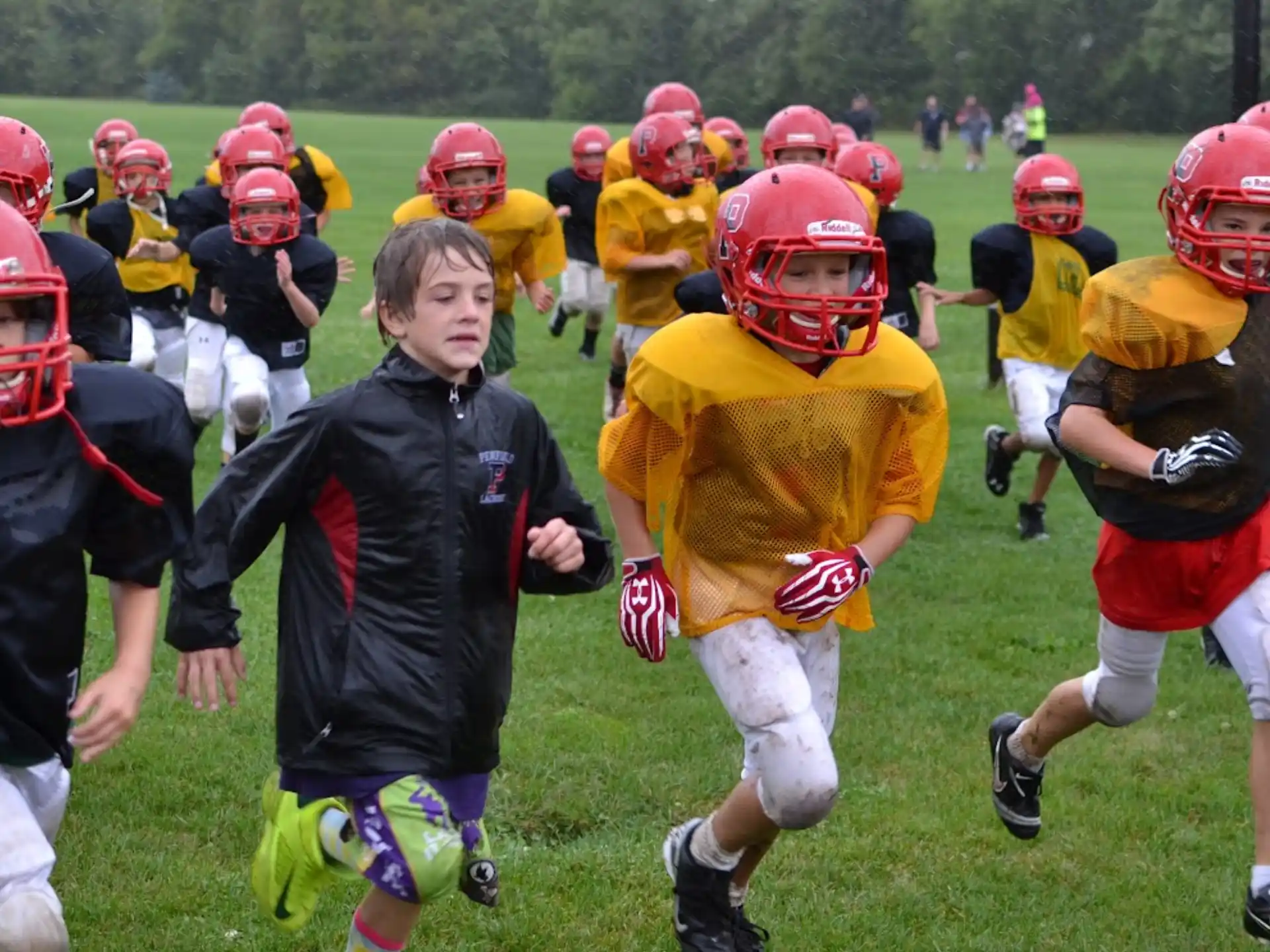a group of kids playing football