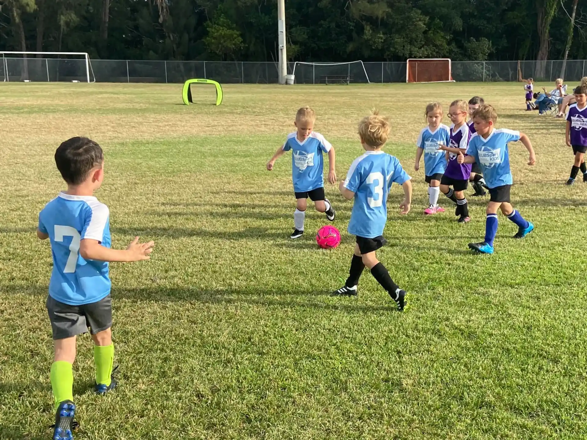 kids playing football on a field