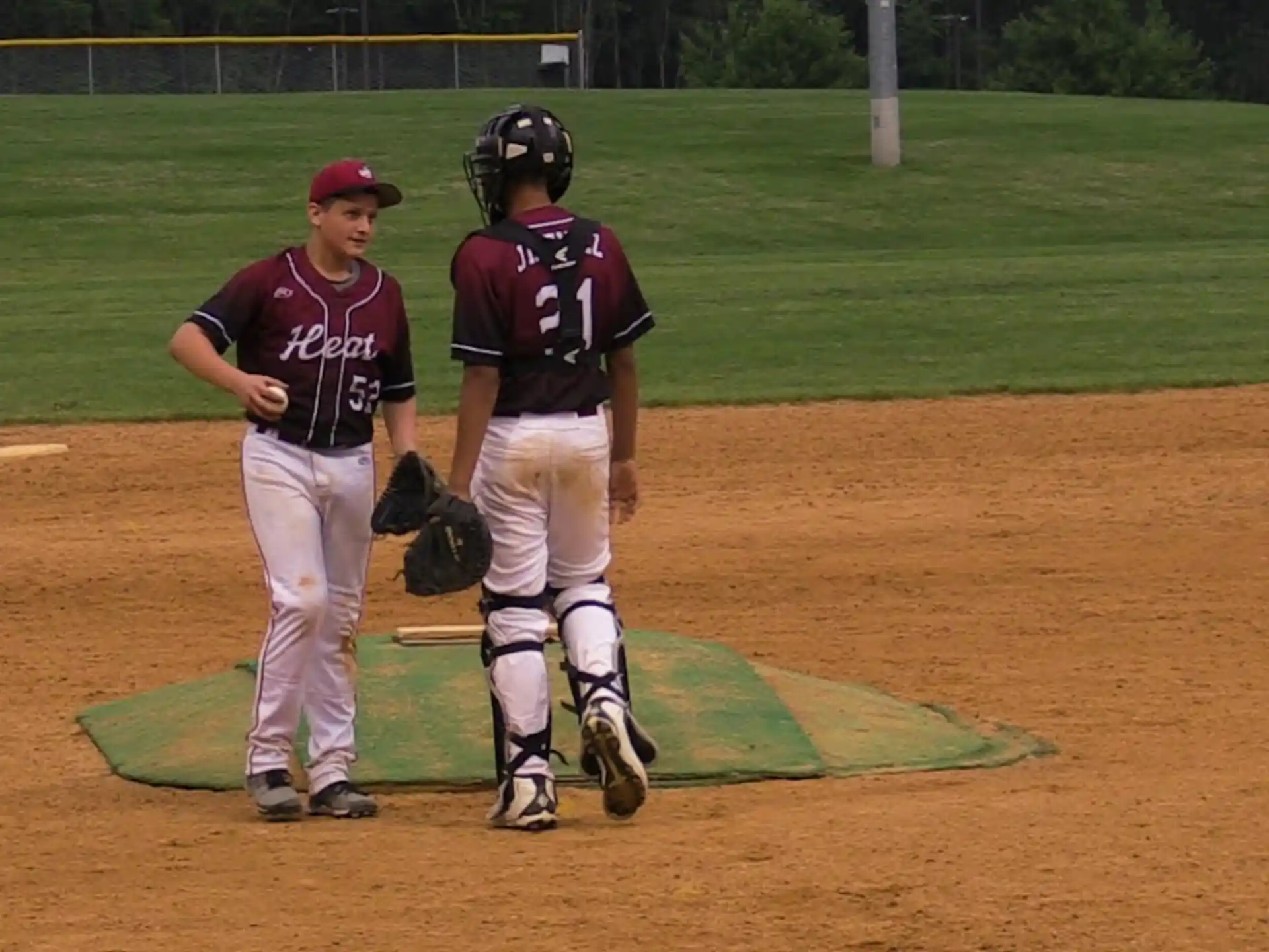 a couple of baseball players on a field