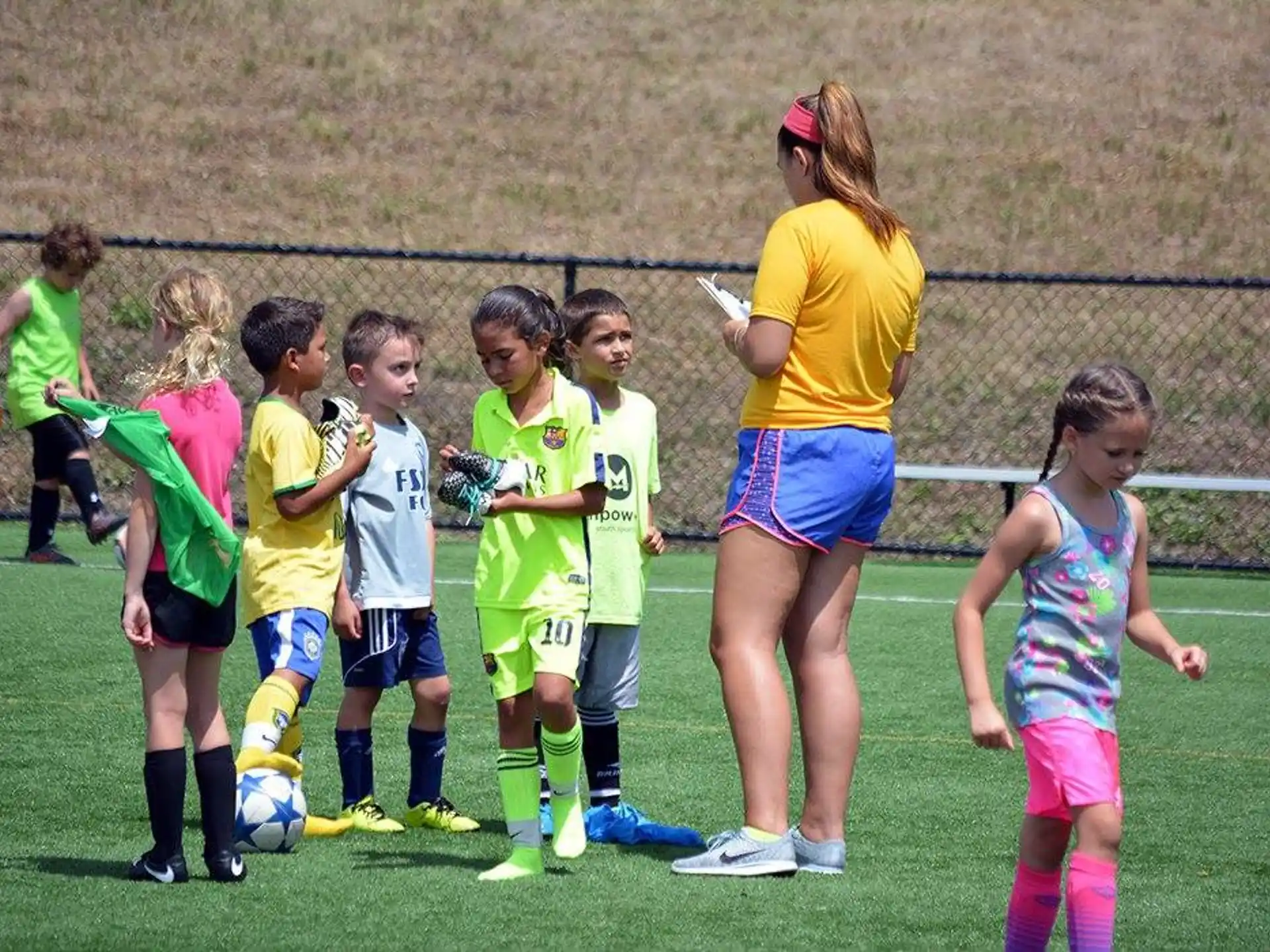 a group of girls in a football field