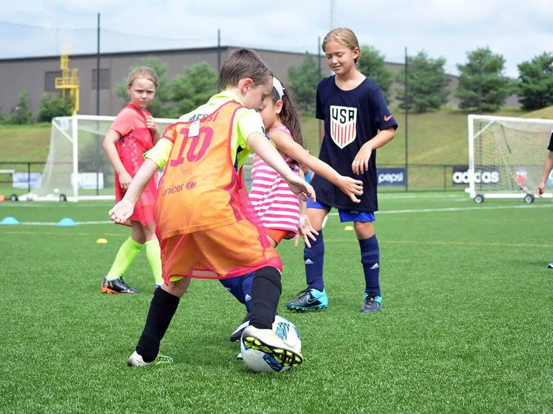 a group of girls playing football