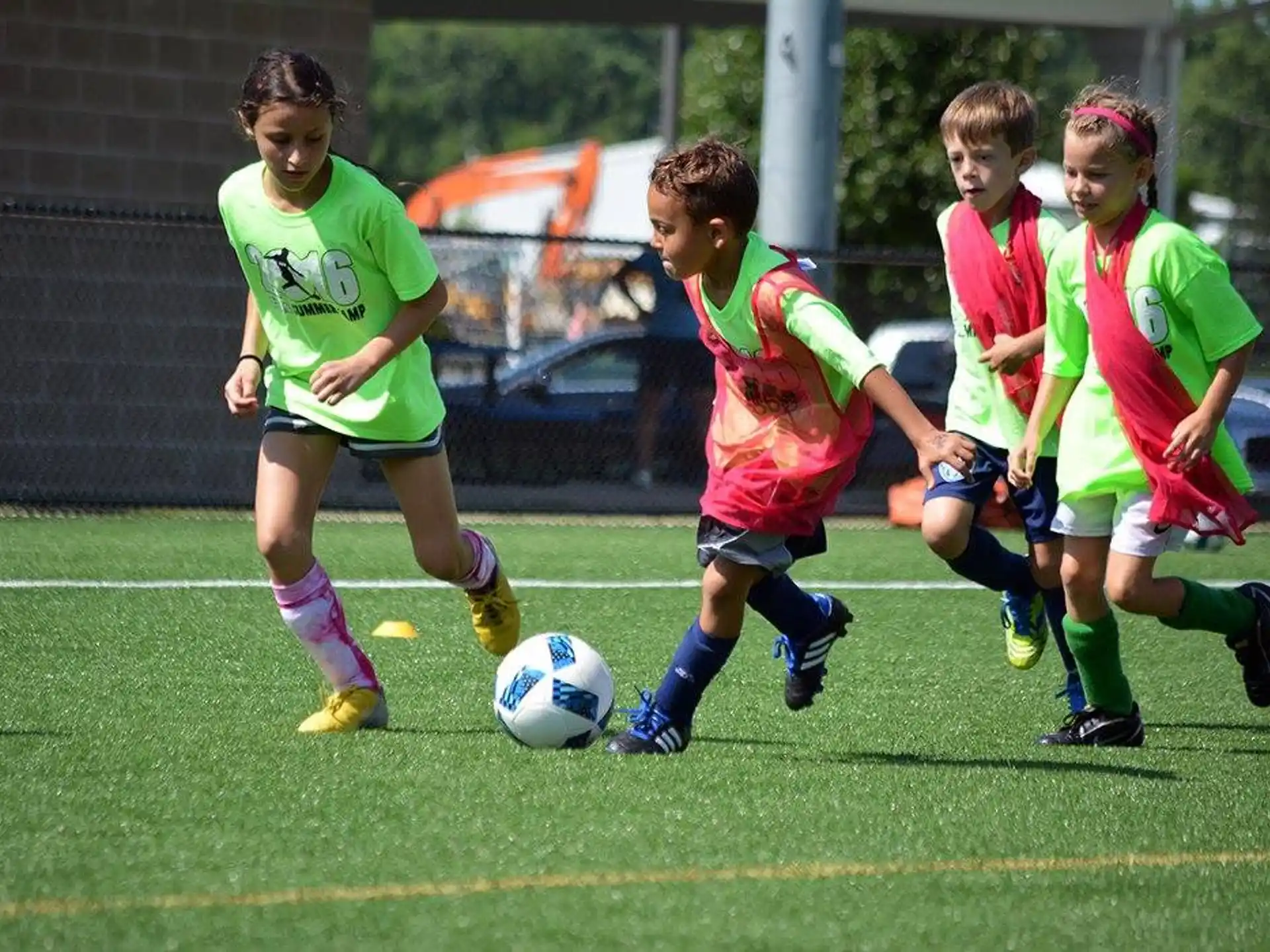 girls playing football on a field