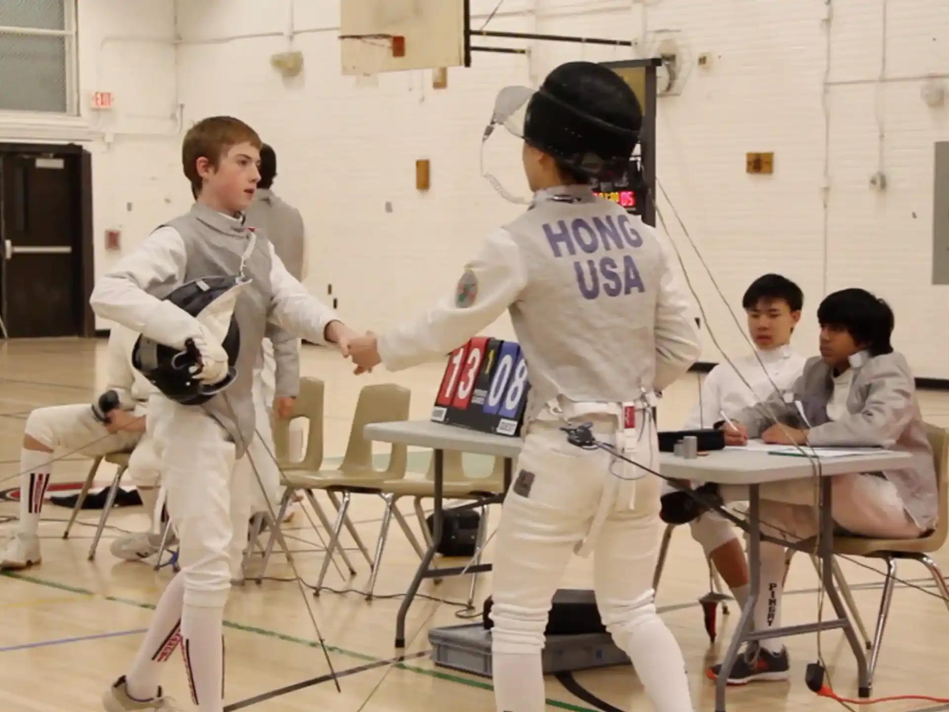 a group of kids in karate uniforms