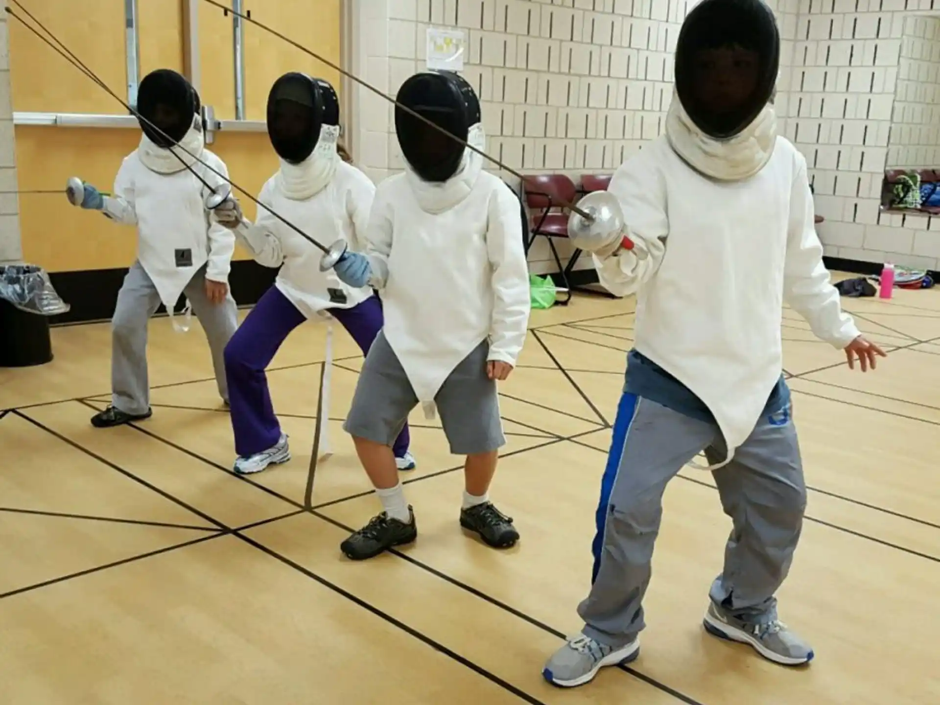 a group of people wearing white outfits