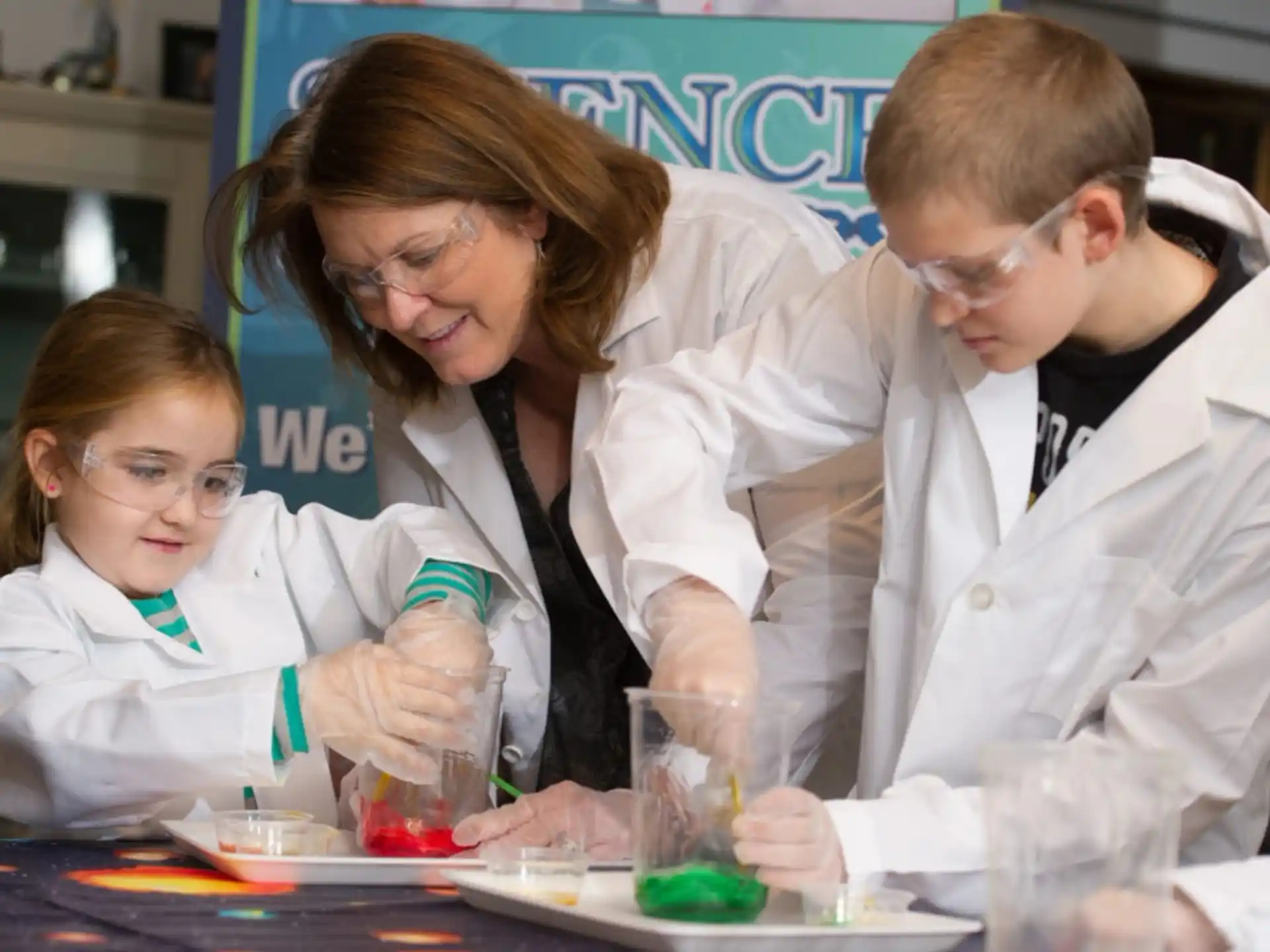 a group of people in lab coats