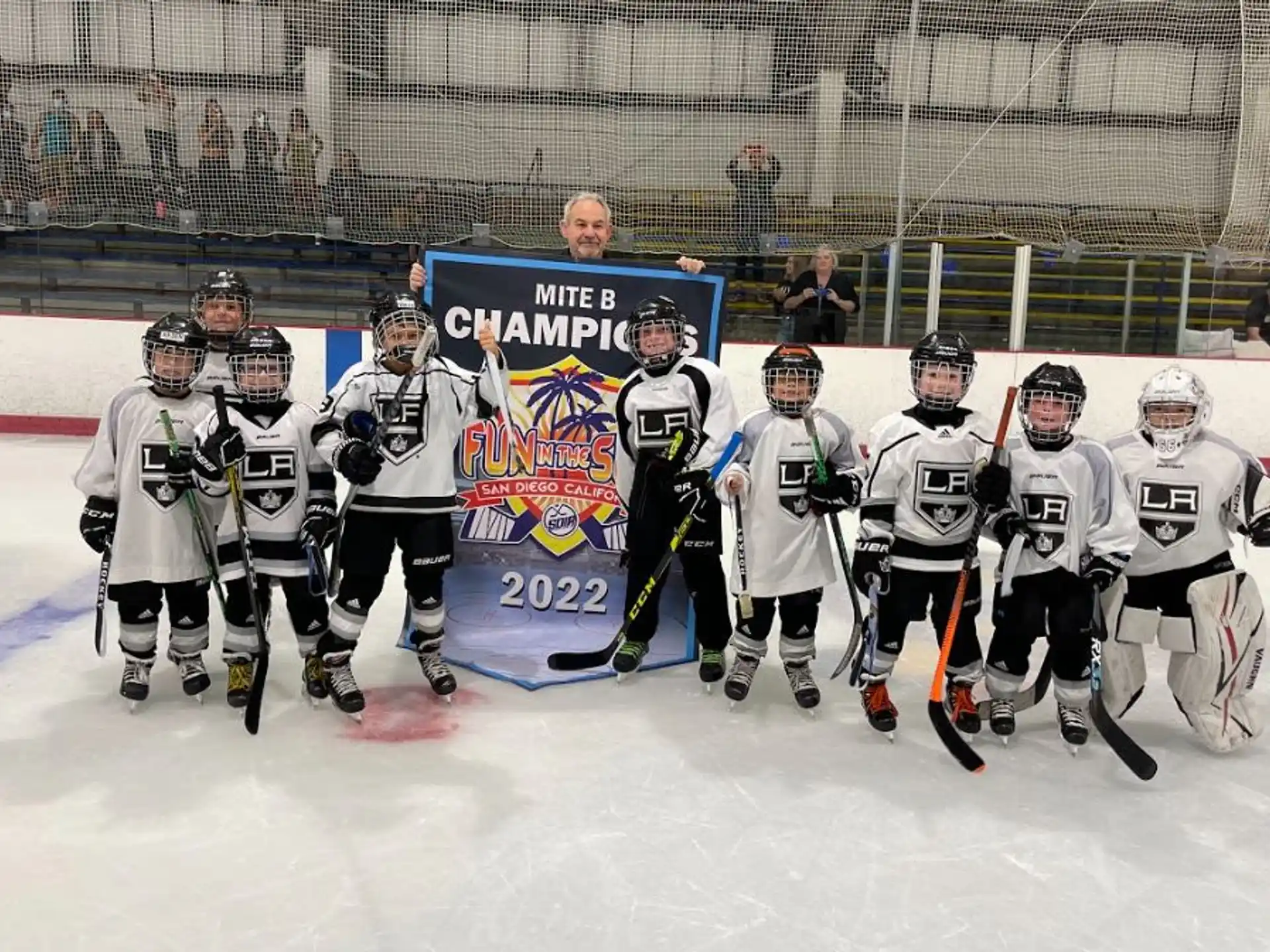 a group of hockey players posing for a photo