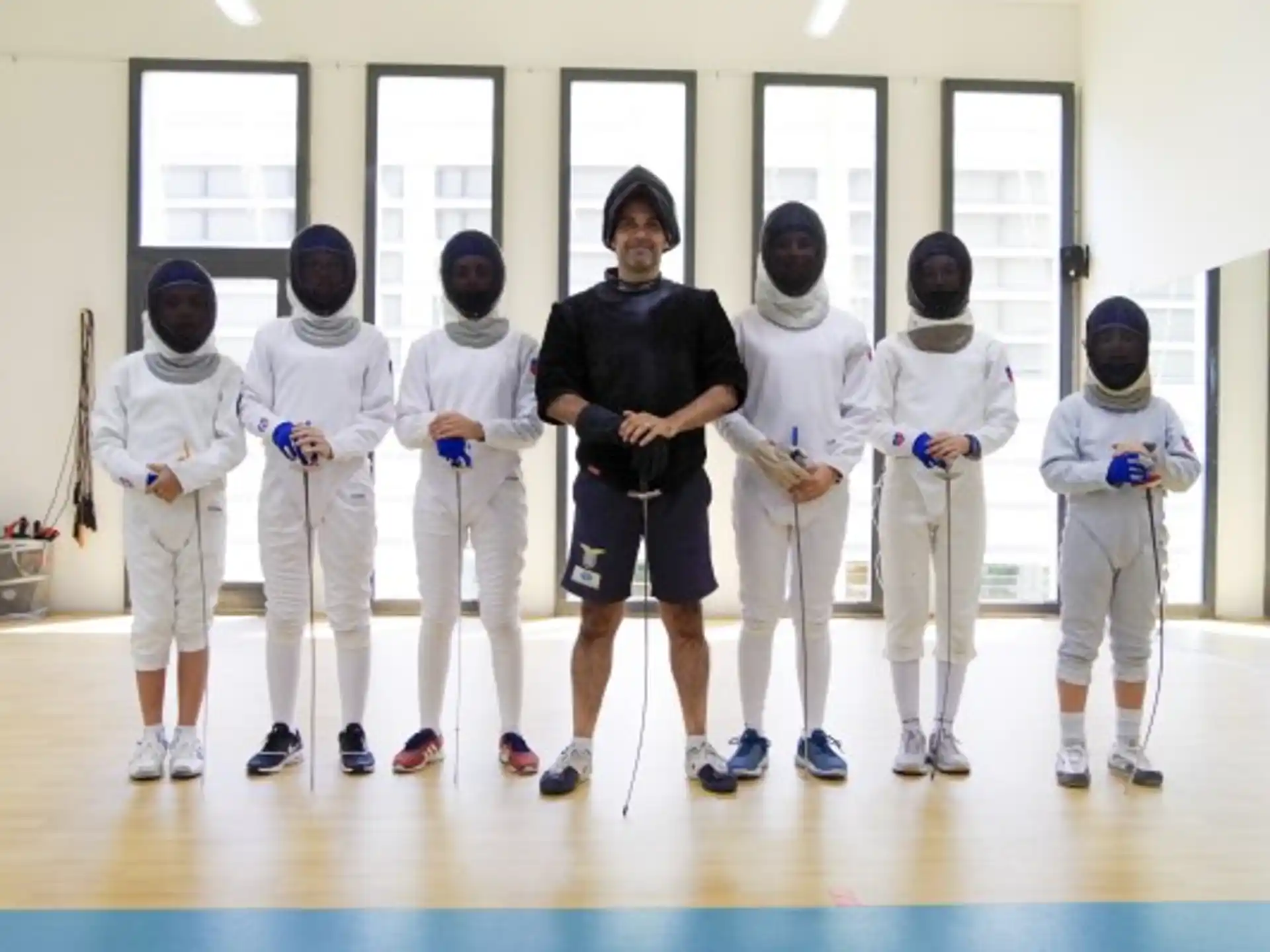 a group of people in karate uniforms