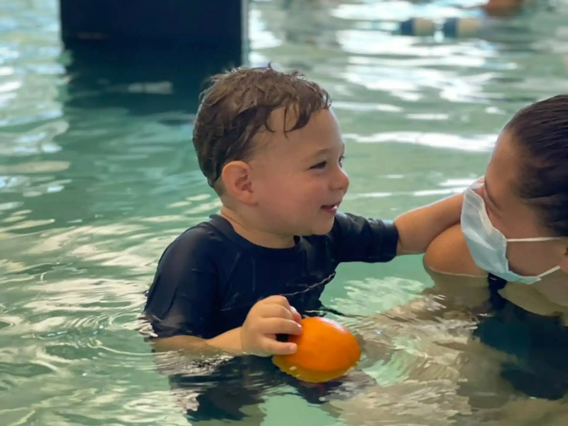 a boy playing in the water