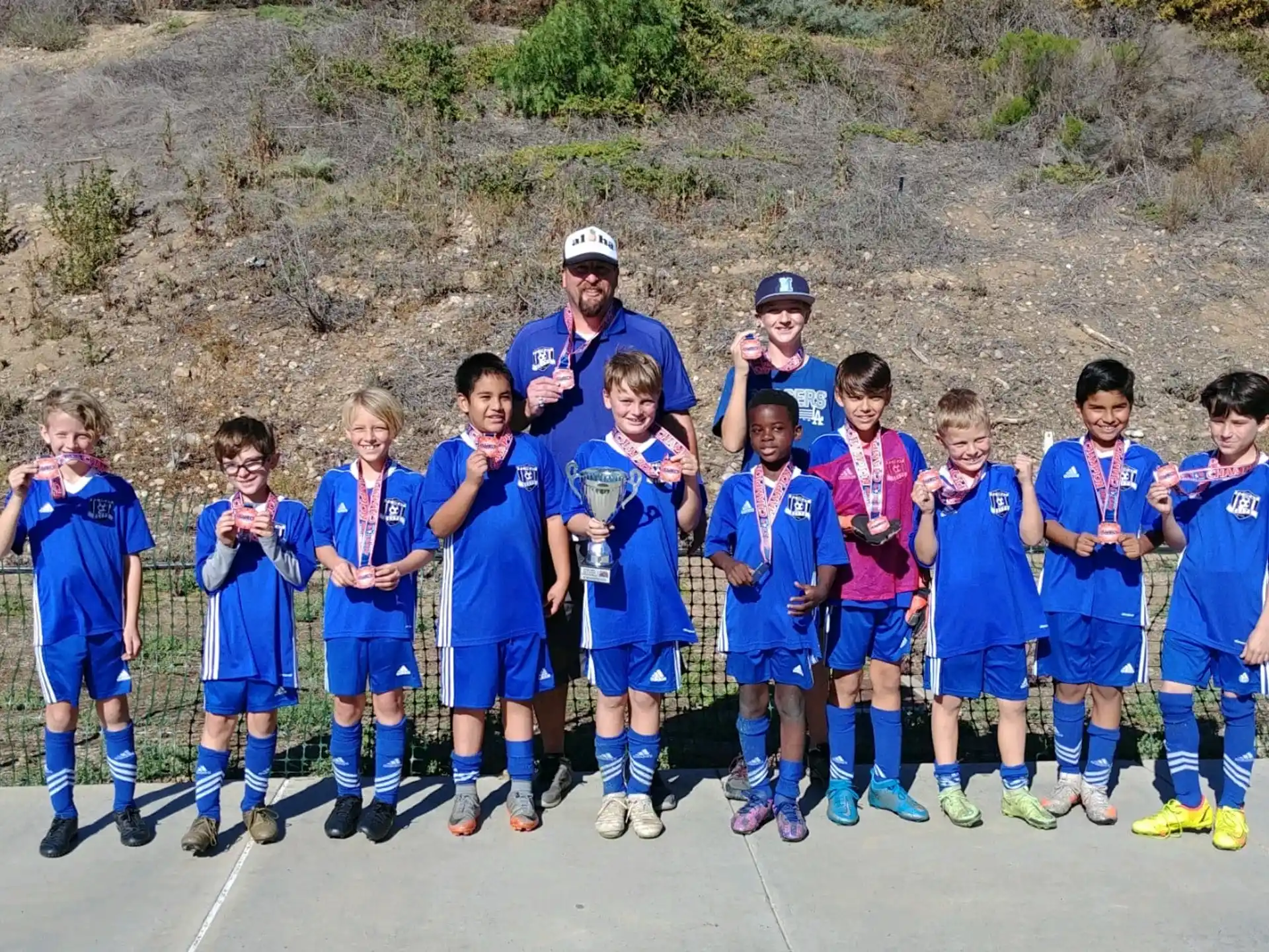 a group of kids in blue uniforms