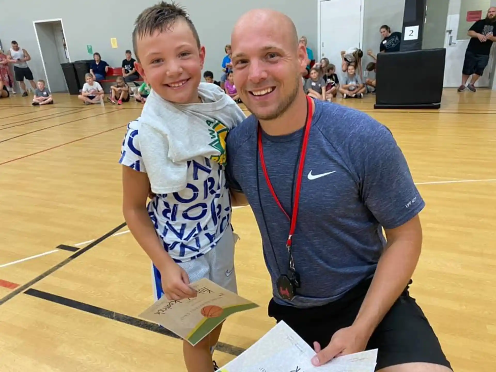 a person and a boy posing for a picture
