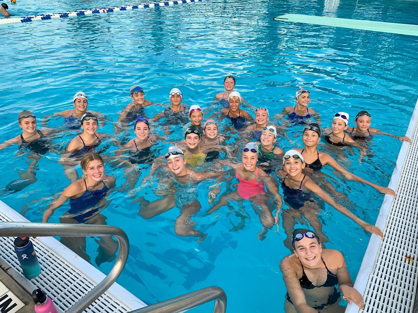 a group of people in a pool
