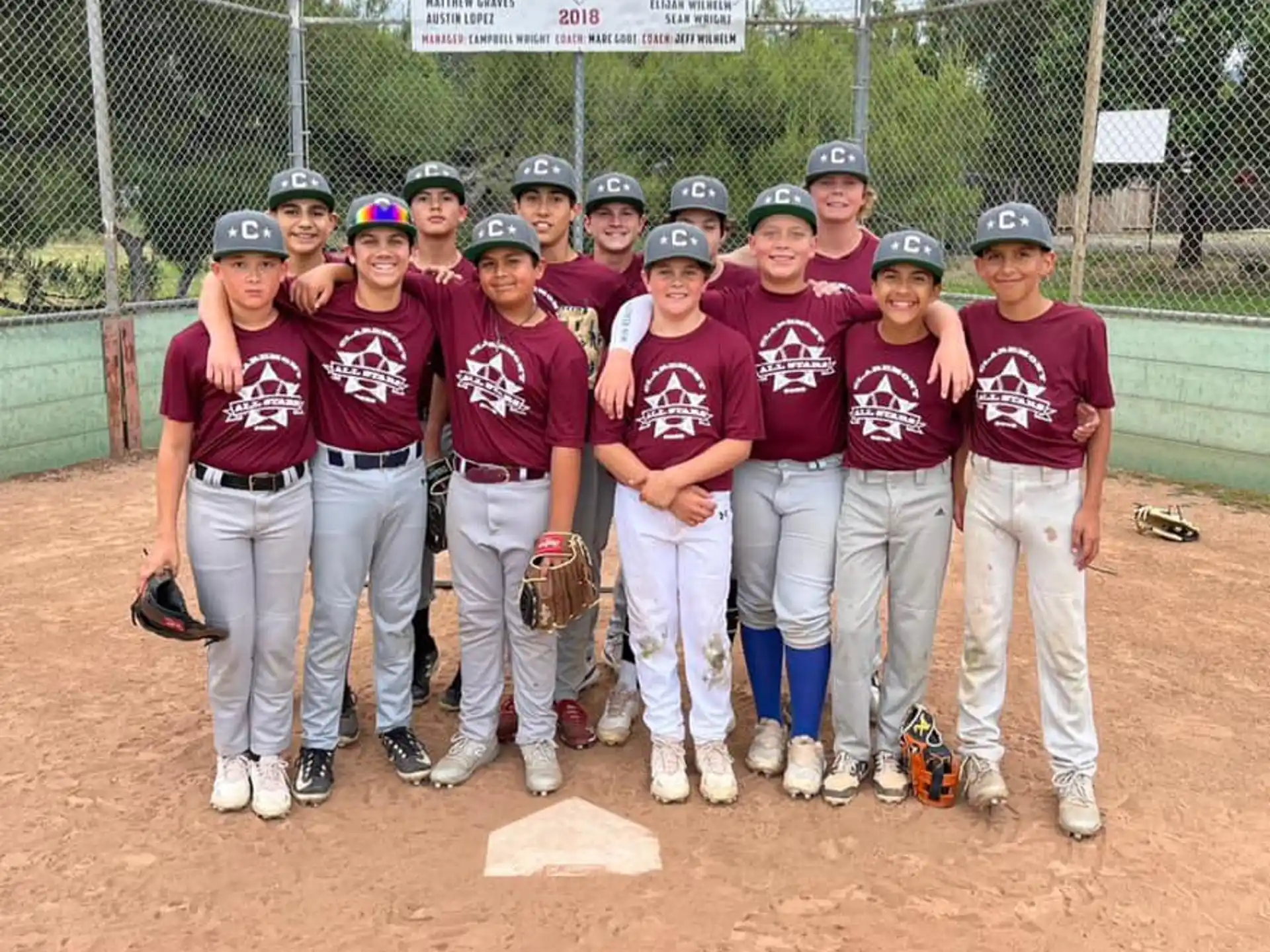 a group of baseball players pose for a photo