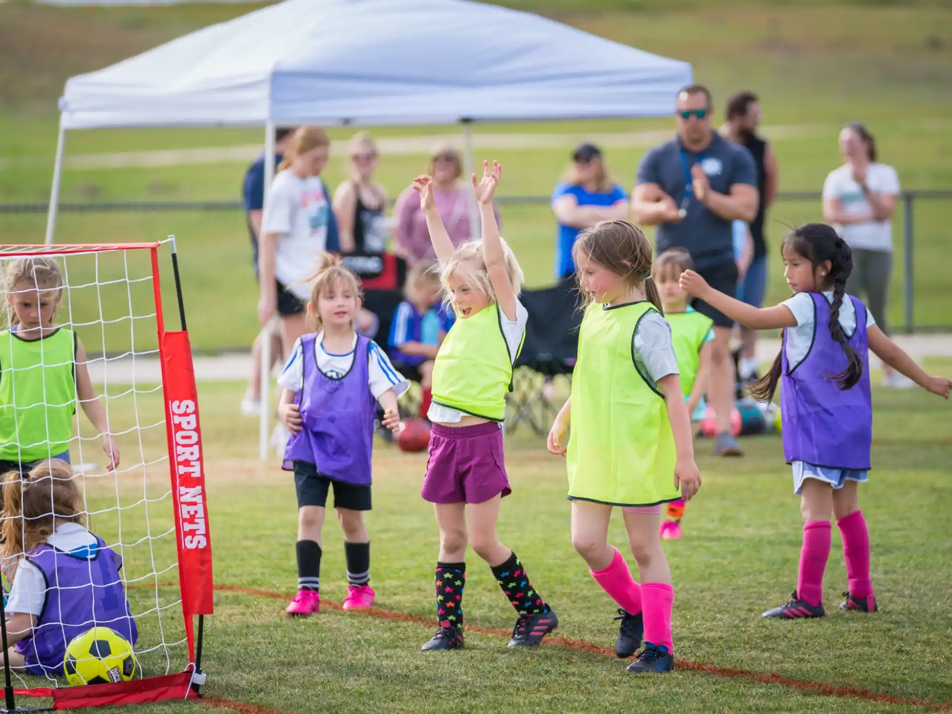 a group of girls playing football