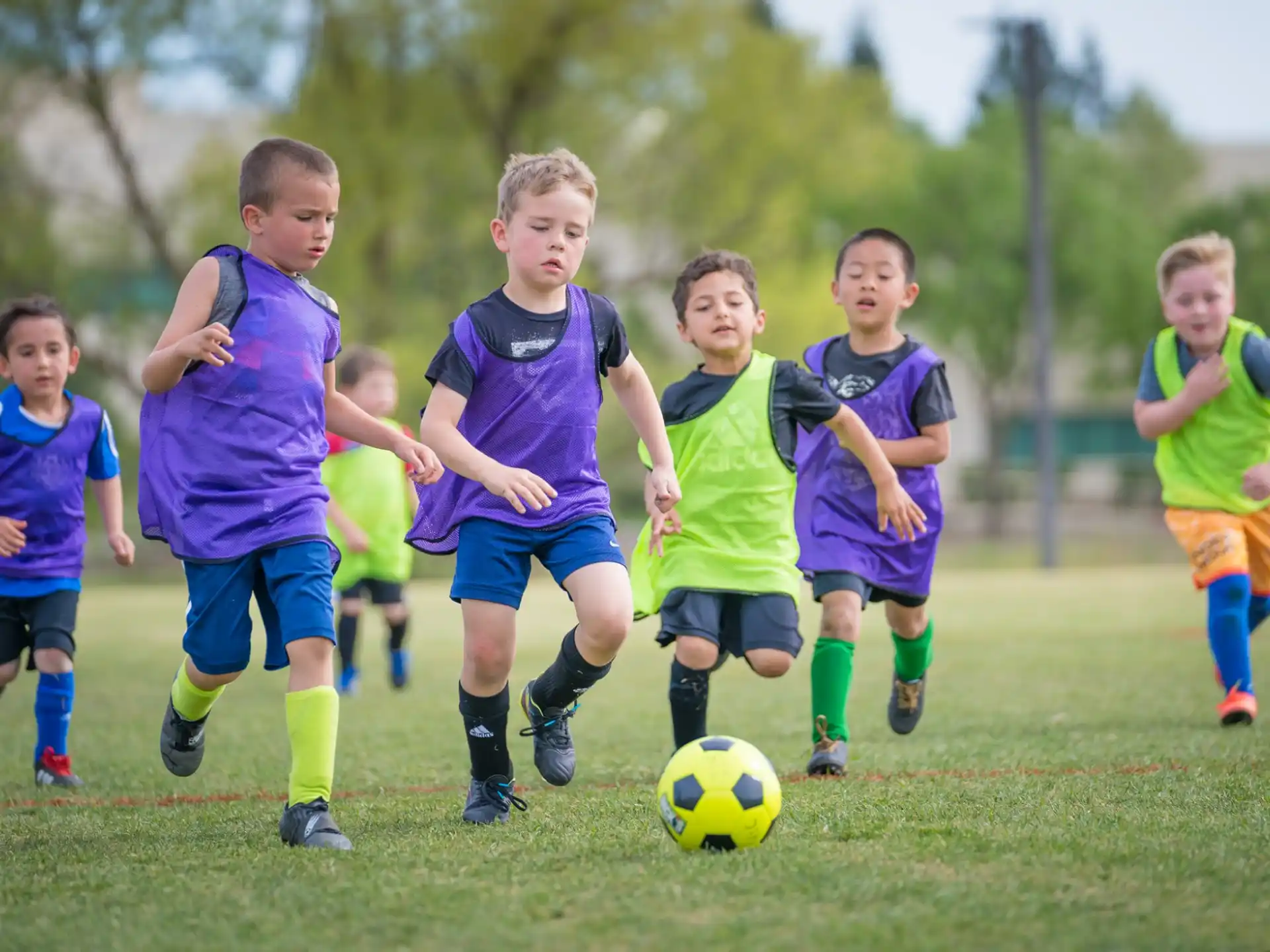 a group of kids playing football